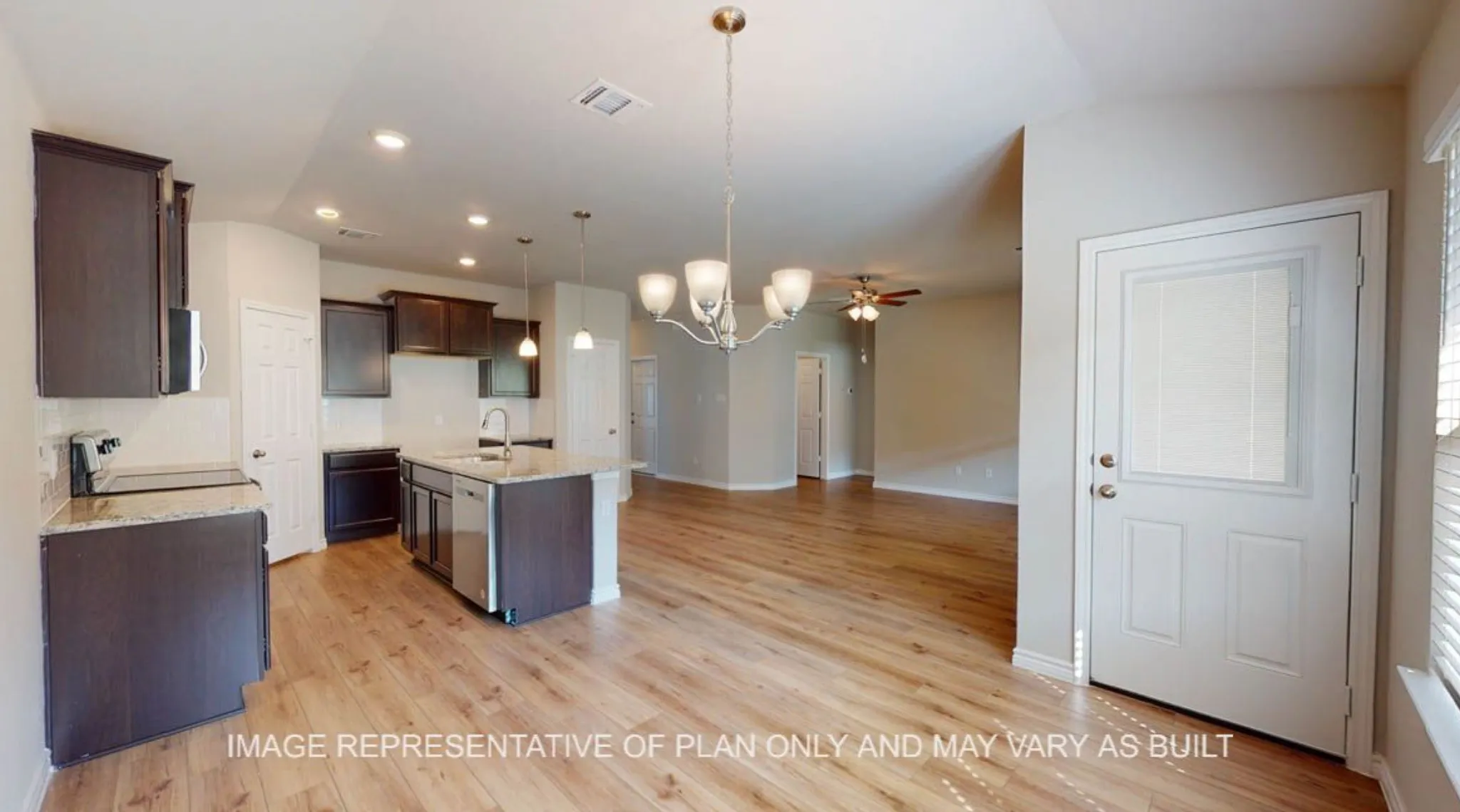 Open-concept living space with wood-finish flooring, a kitchen island, dark wood cabinetry, stainless steel appliances, and recessed lighting