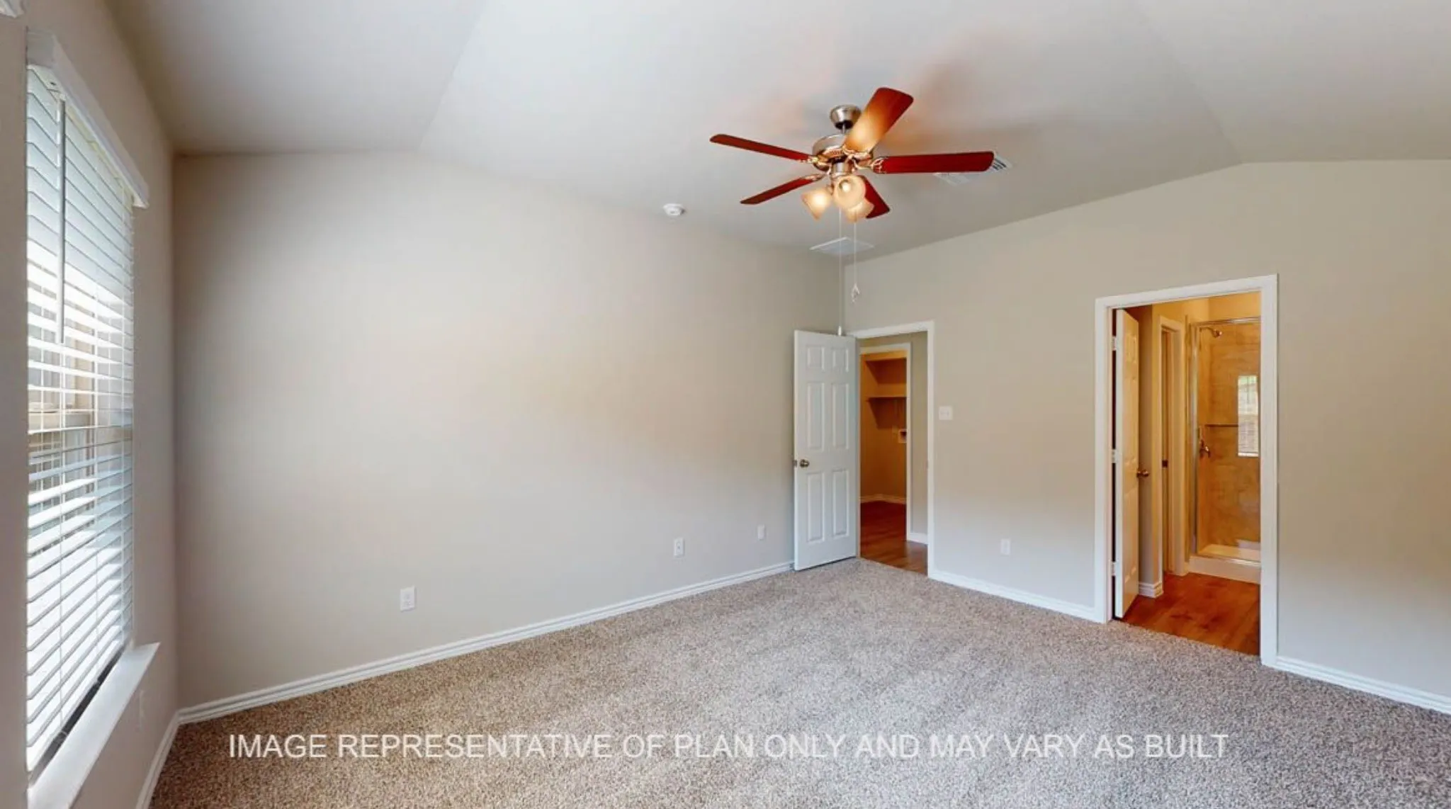 Vaulted ceiling with an attached ceiling fan, carpeted flooring, and a walk-in shower with wood-finish flooring