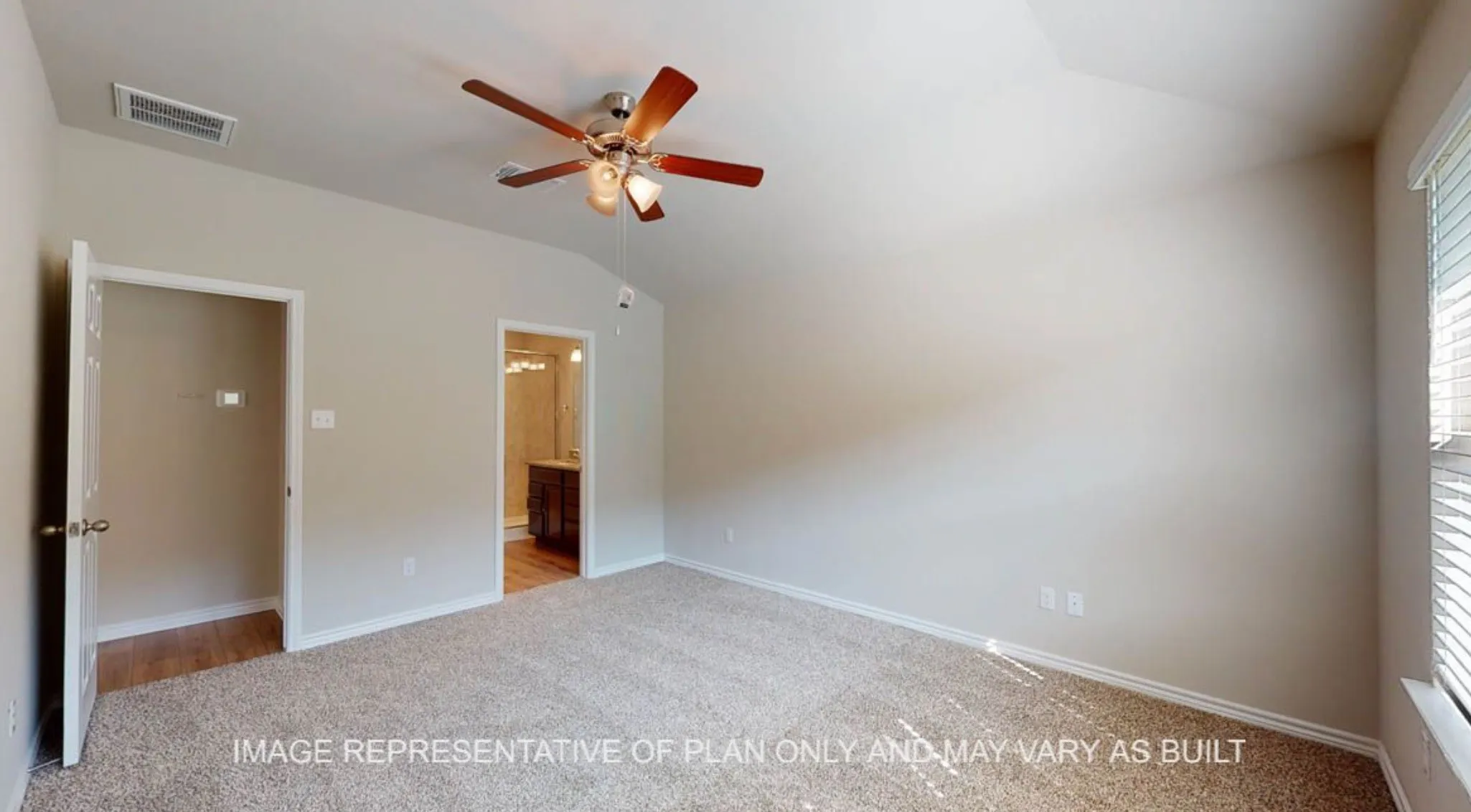 Carpeted flooring, vaulted ceiling, and a ceiling fan with integrated lighting