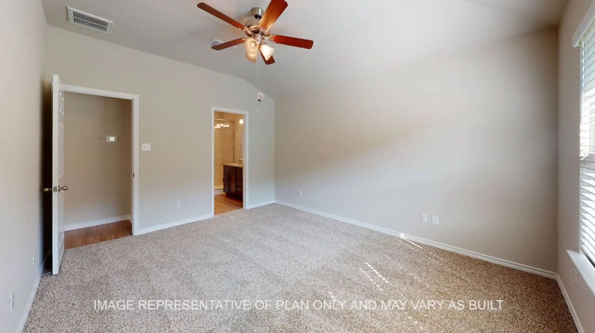 Vaulted ceiling with a ceiling fan, plush carpeting, light-toned wall paint, and a window with blinds