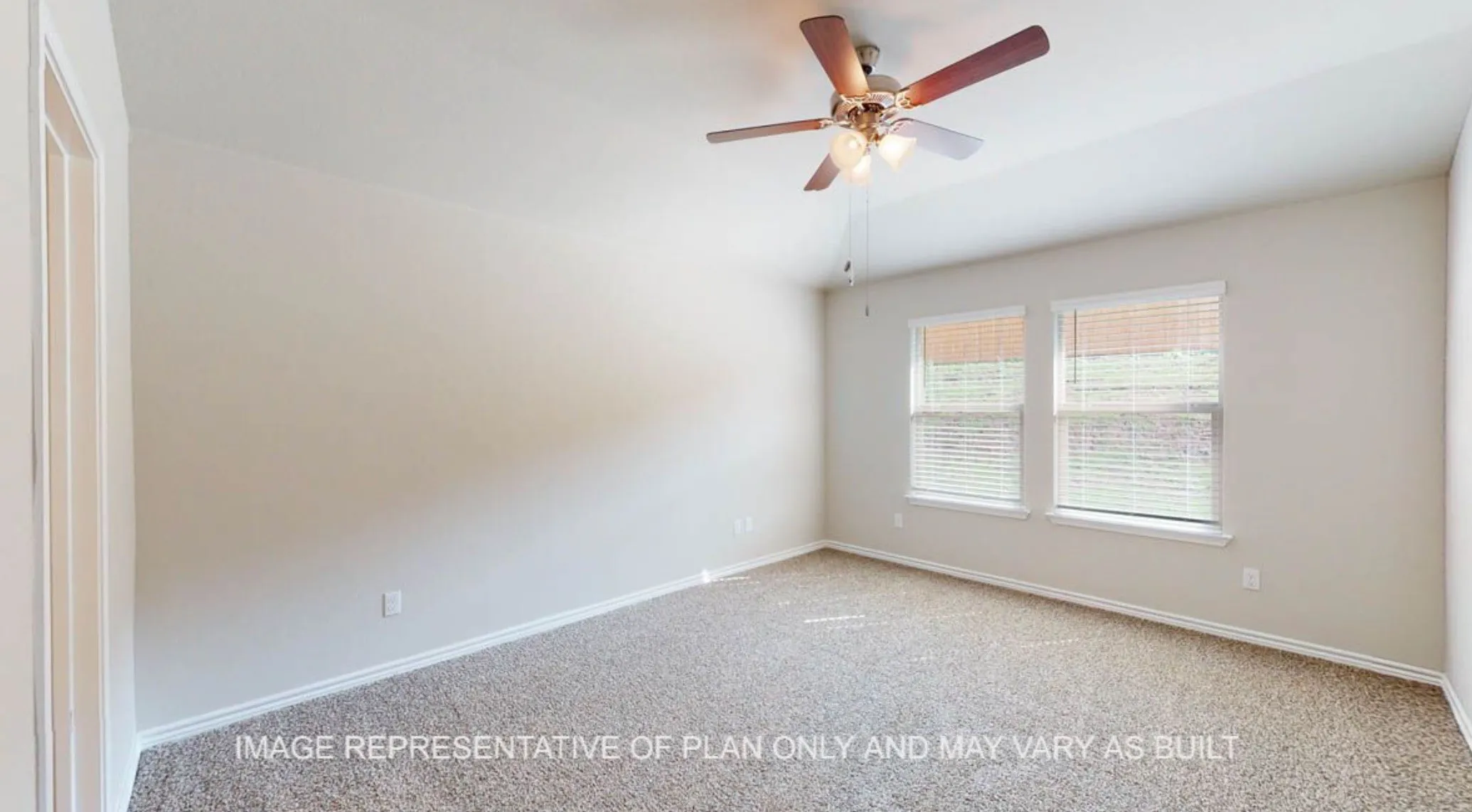 Neutral-toned walls, textured carpeting, and a ceiling fan with integrated lighting