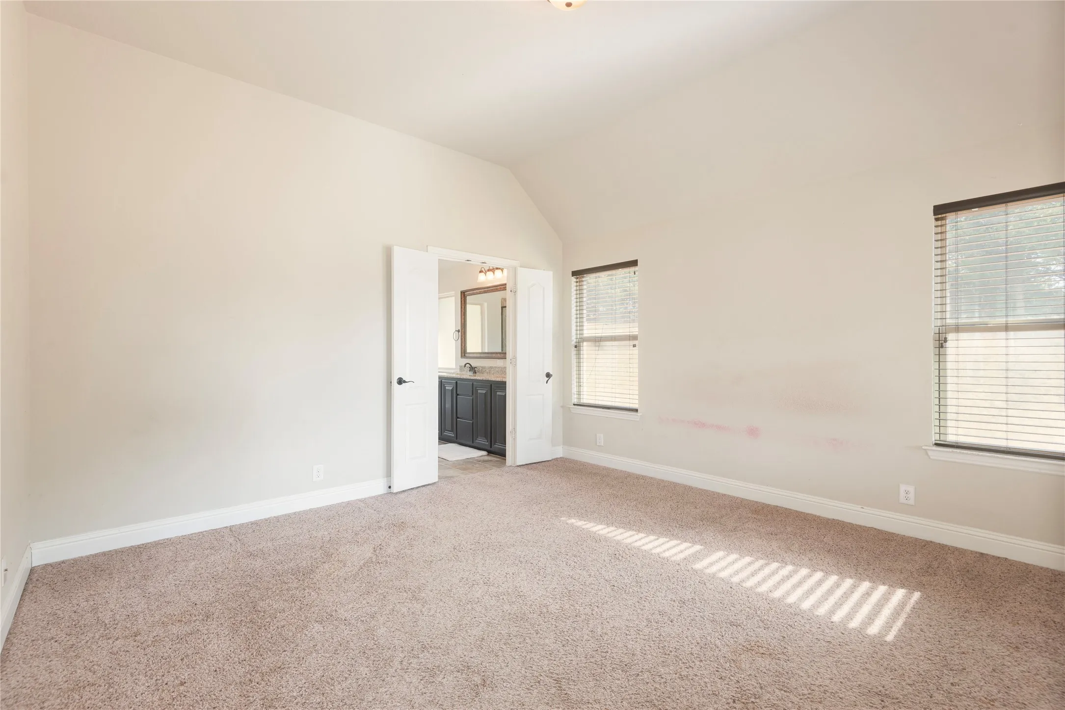 Primary bedroom downstairs with ensuite bathroom