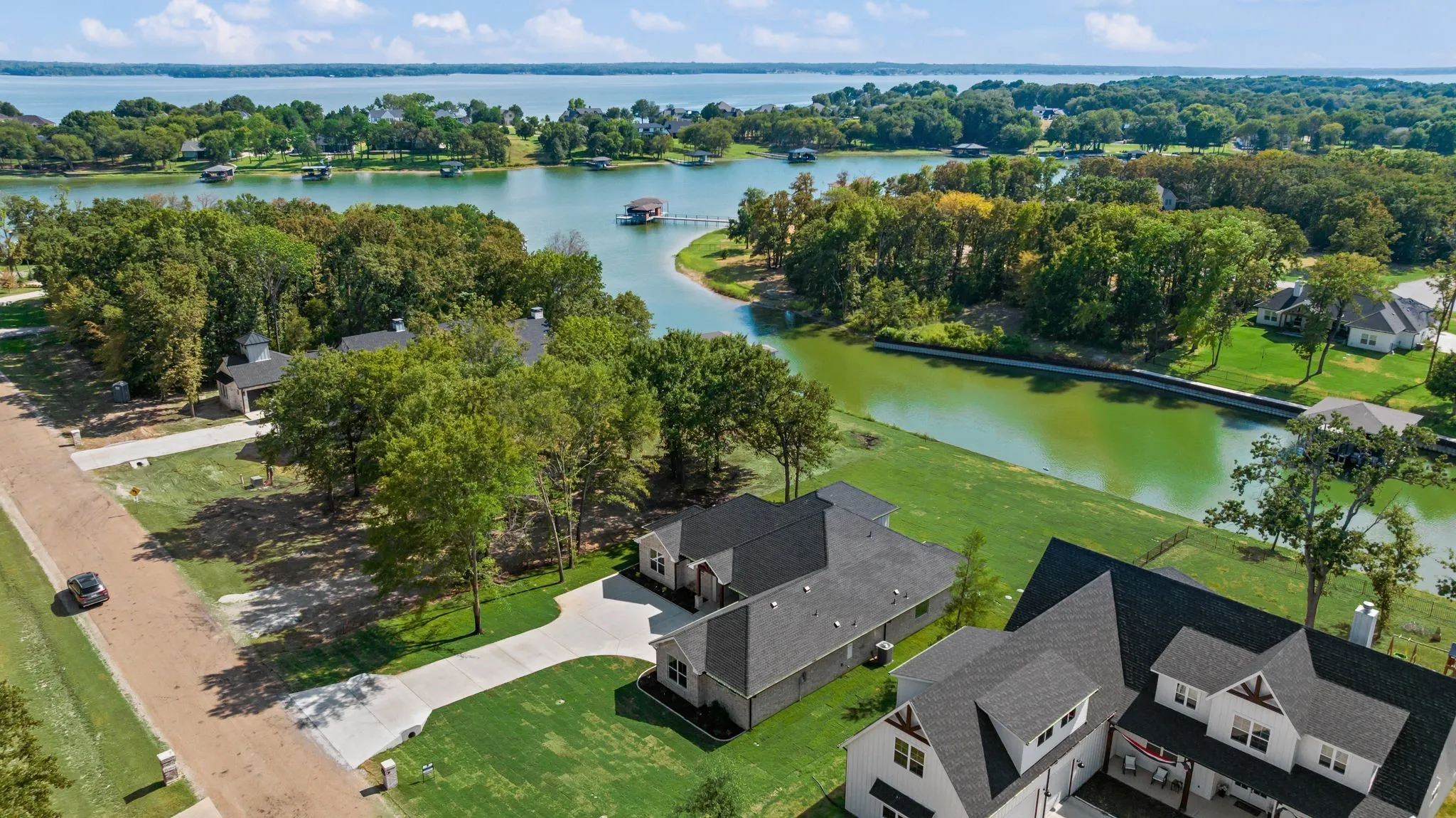 Aerial perspective highlights the home's location near the water and the beautiful lake-oriented setting of The Shores community.