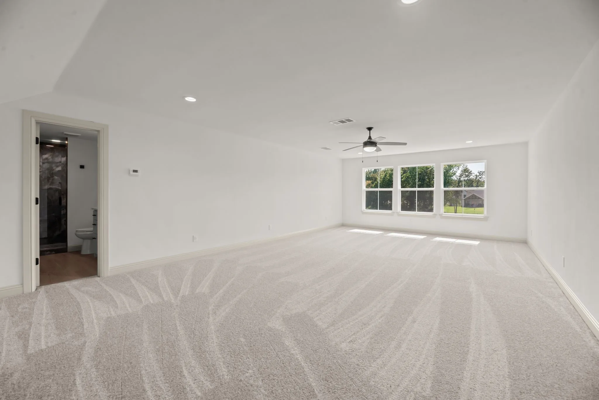 Large upstairs bonus room offers flexible space for a game room, media room, bunkroom, or second living area.