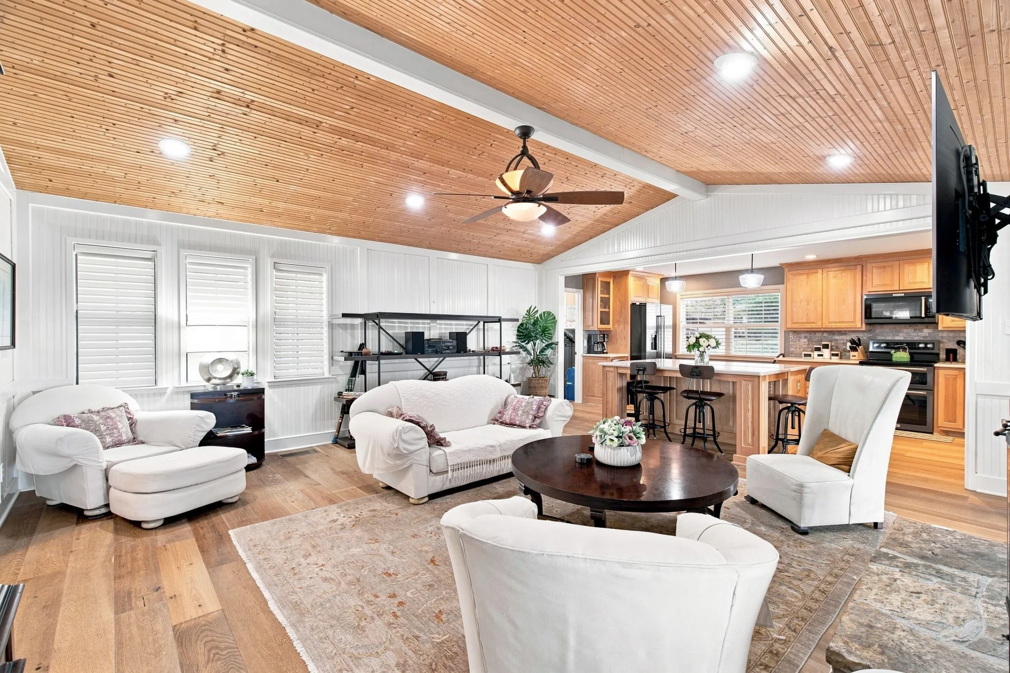 Vaulted wood-finish ceiling with recessed lighting