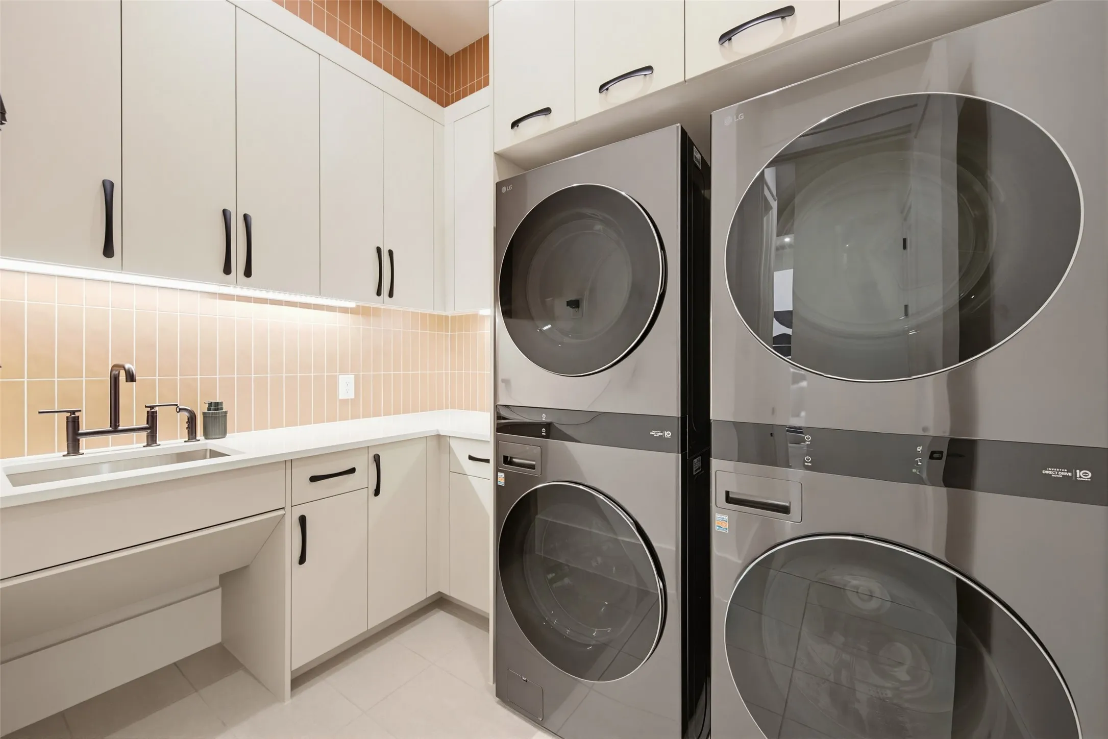 Two stacking washer and dryer units convey with the home.