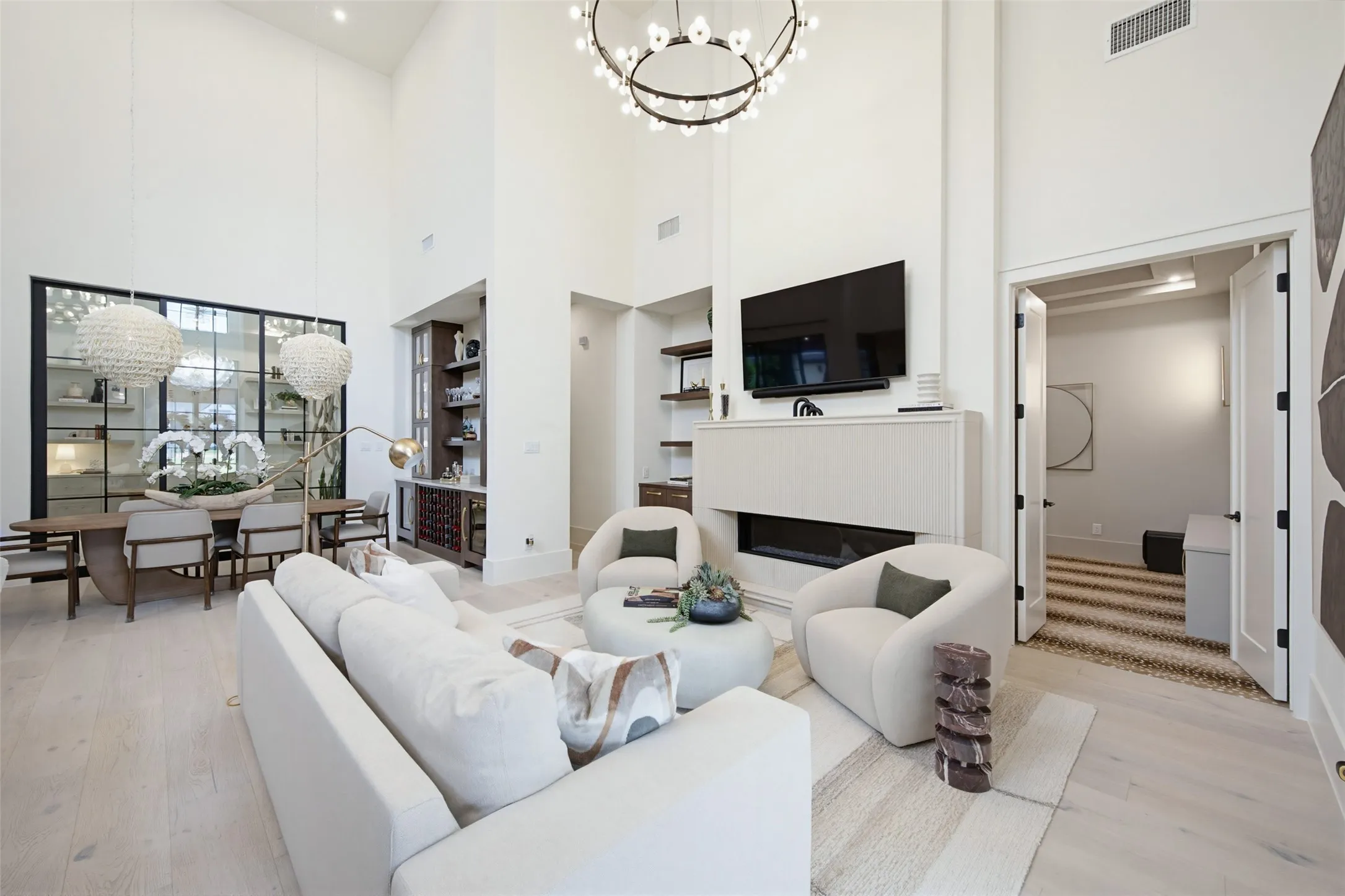 Open concept living, dining and kitchen. Custom fireplace feature.