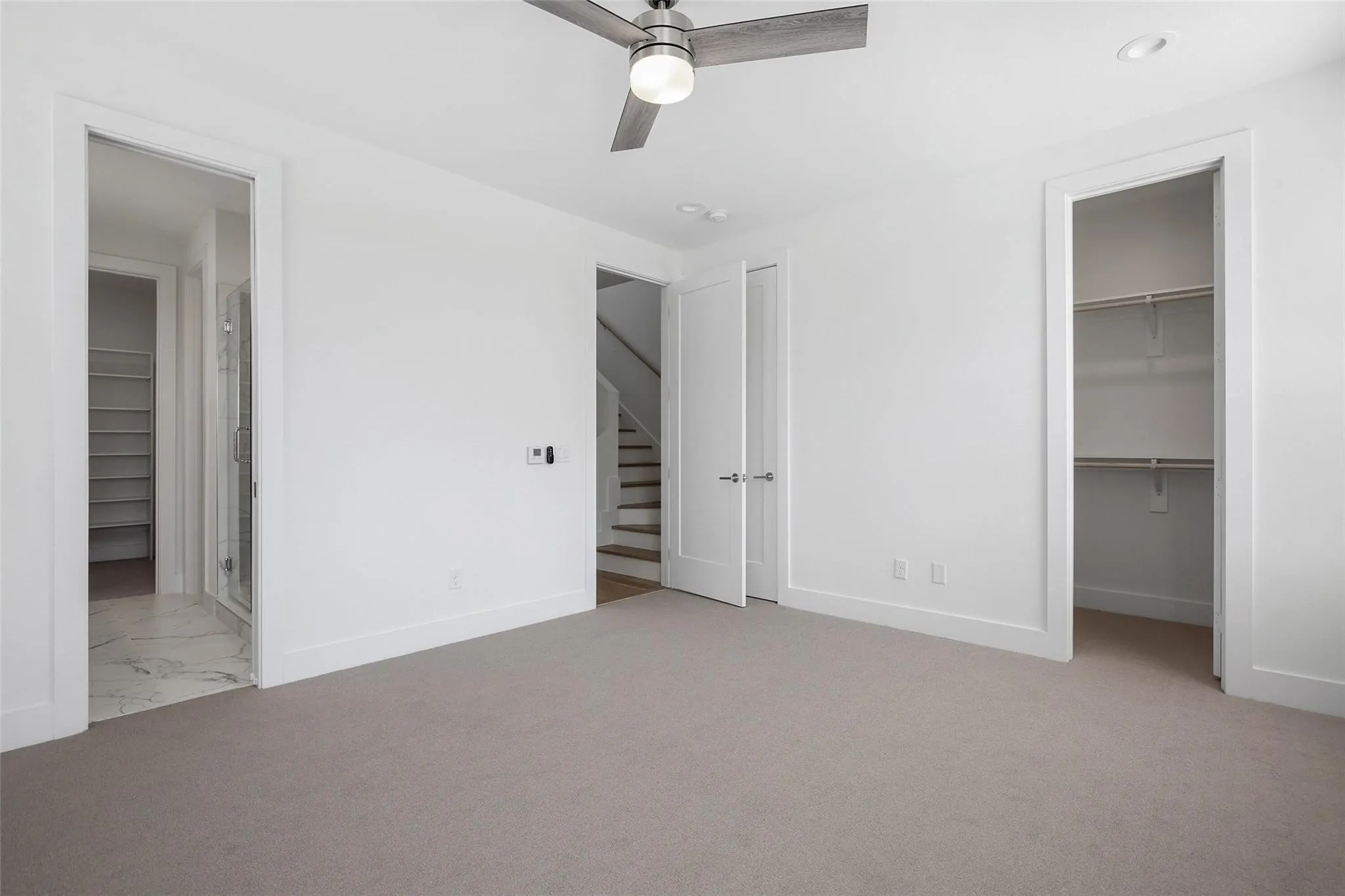 Plush carpet flooring, recessed lighting, and a contemporary ceiling fan