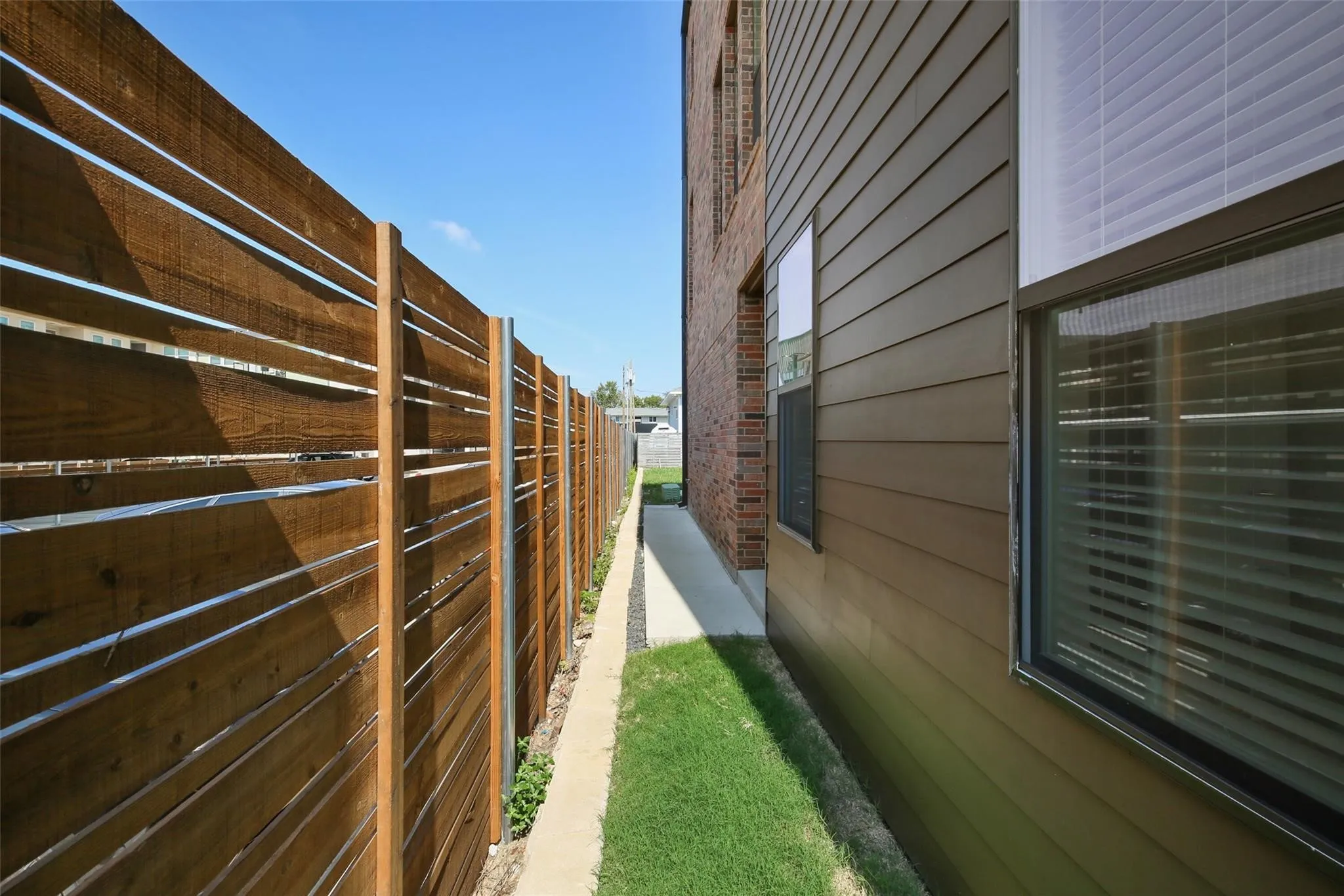 Modern horizontal slat privacy fence