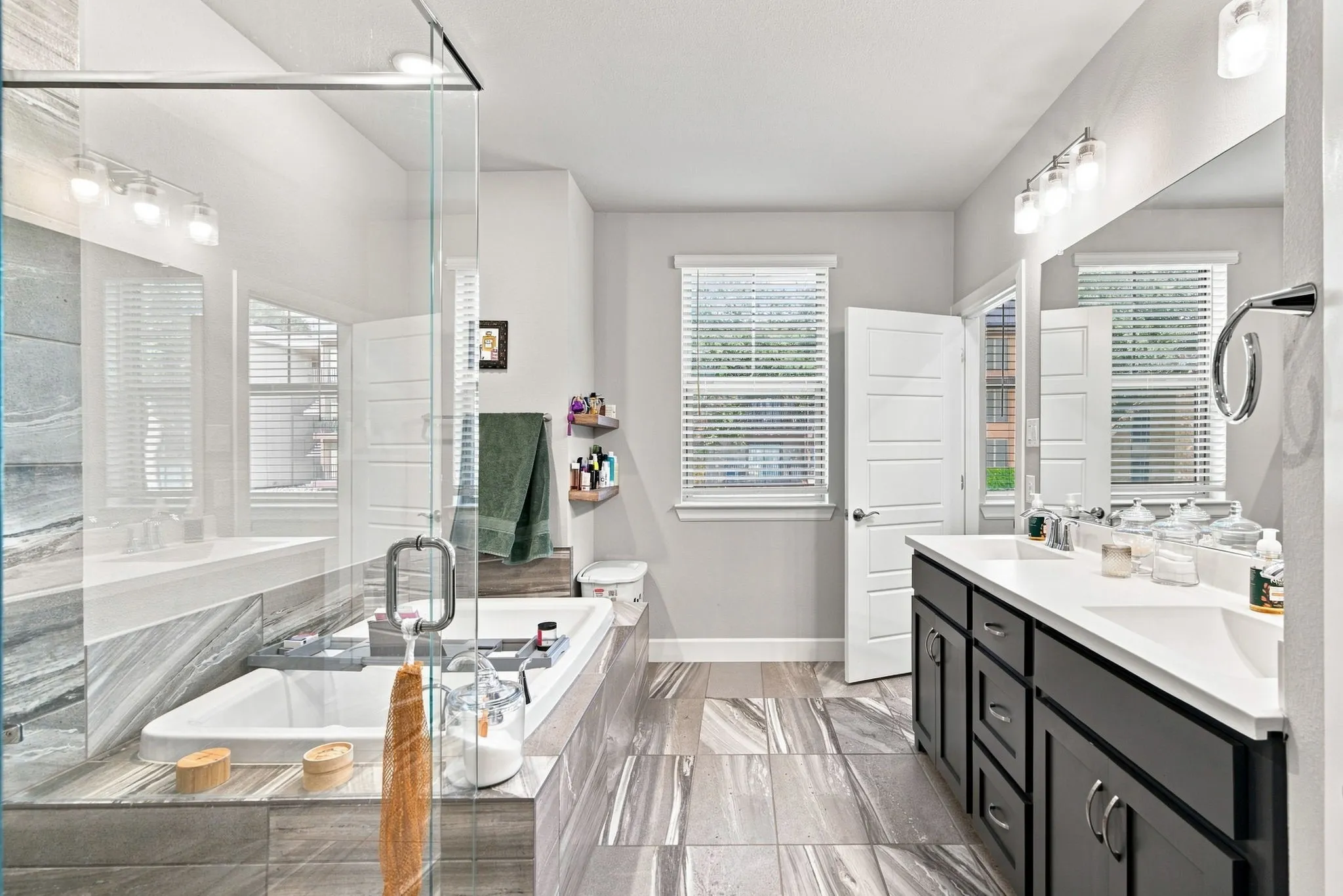 Double vanity with undermount sinks and dark cabinetry