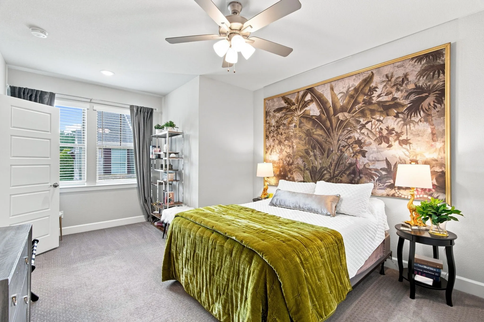 Ceiling fan with integrated lighting, recessed lighting, double window with blinds, paneled interior door, and carpet flooring