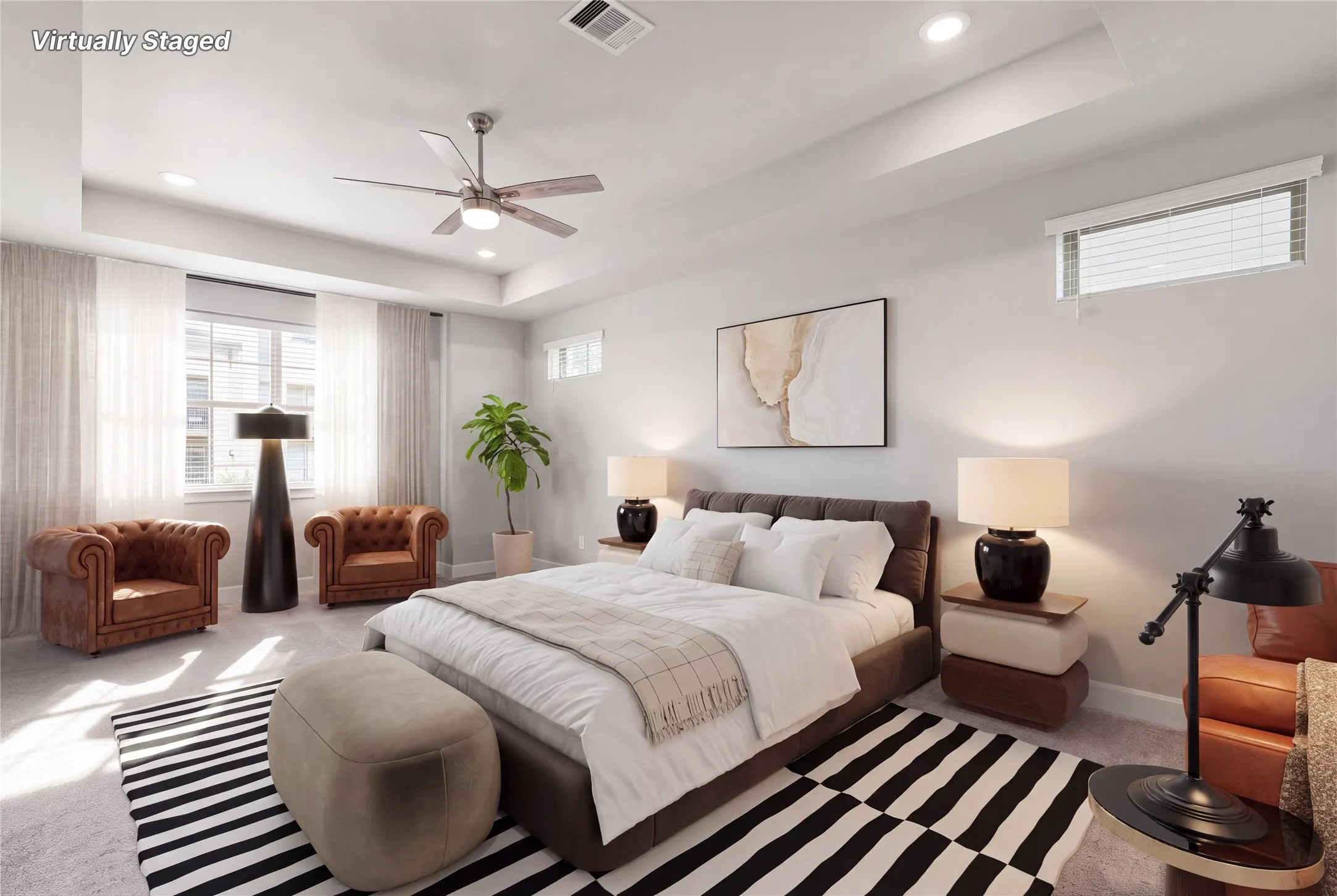 Virtually staged primary bedroom showcasing abundant living space within bedroom