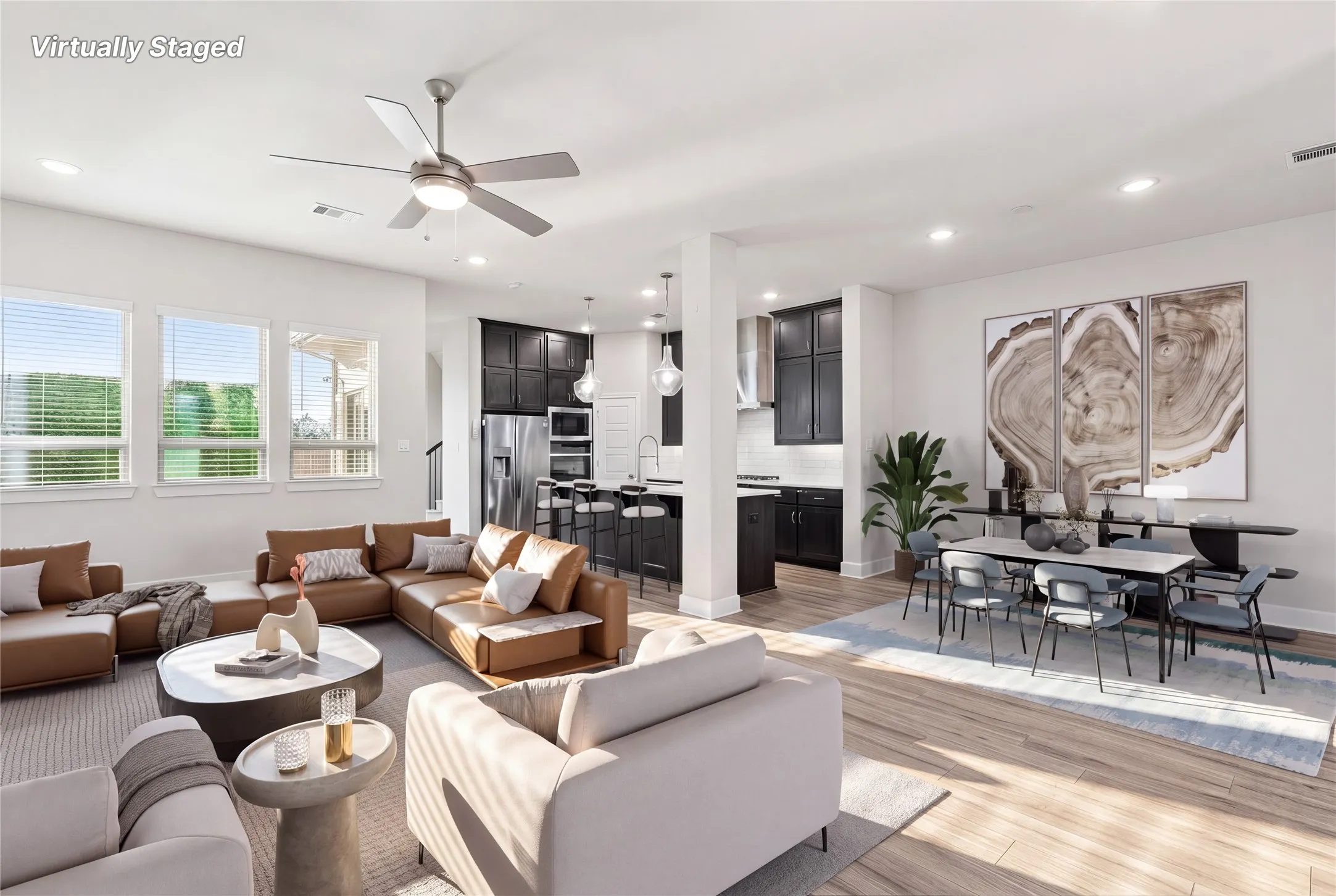 Virtually staged open concept first floor with living room, dining room, and eat-in kitchen