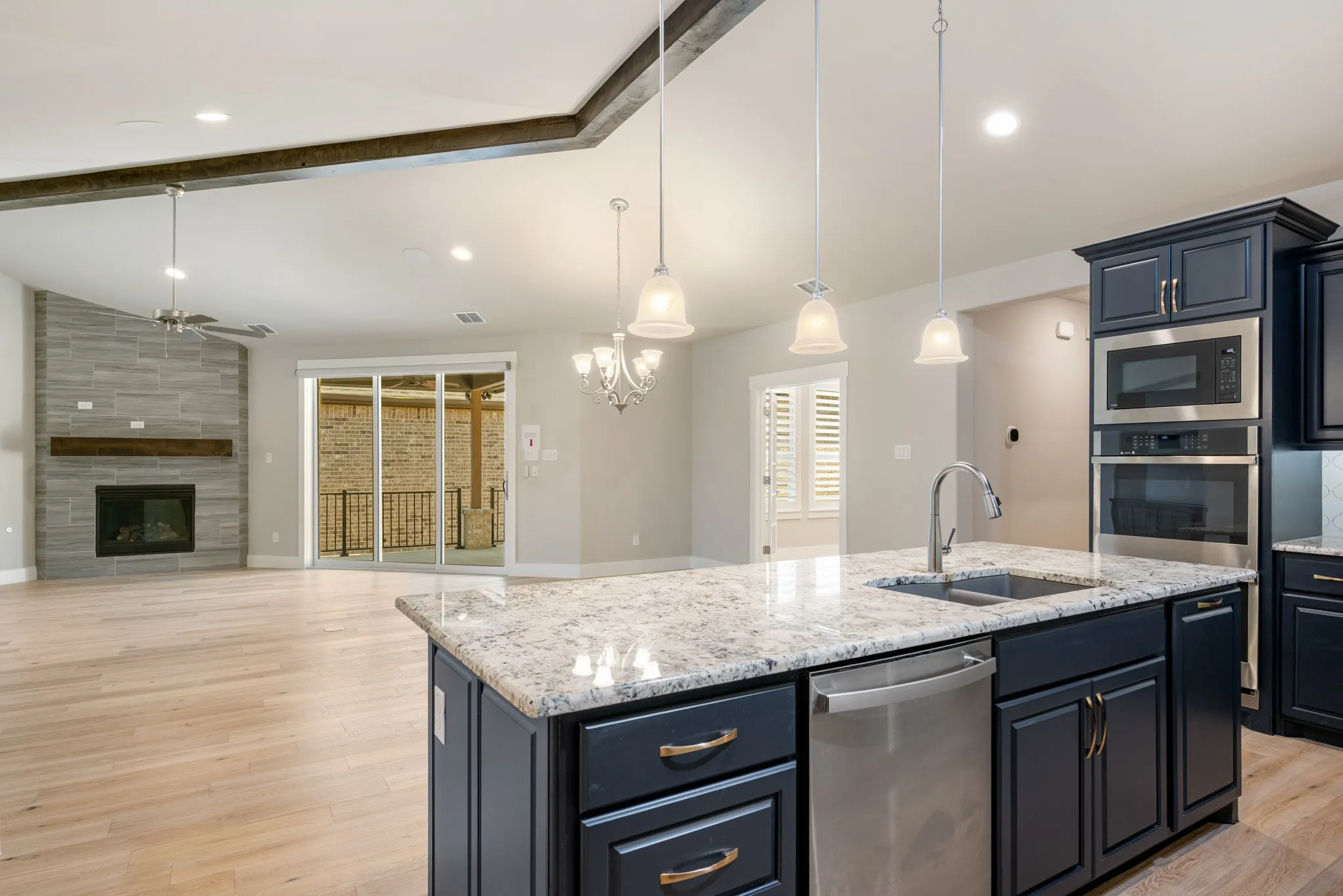 Beautiful island in kitchen has built in storage, dishwasher and sink. Upgraded cabinet package with soft close doors and drawers. Pull out drawers and built in spice racks as well.
