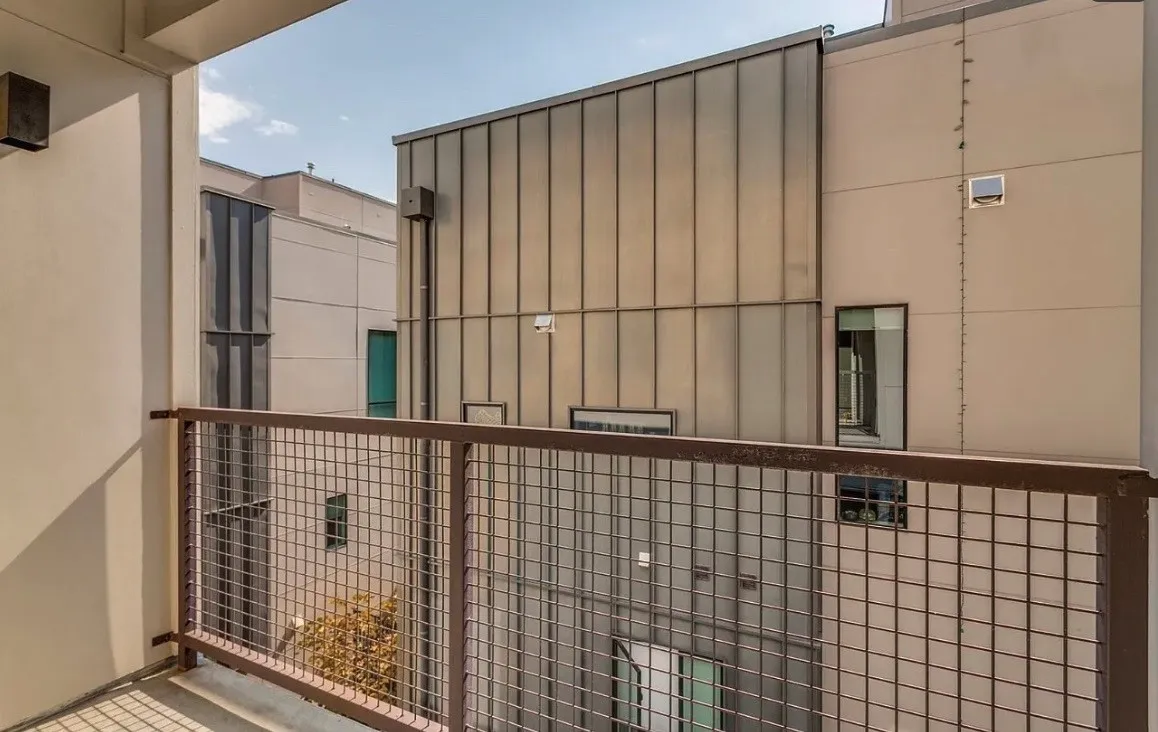 Balcony with a metal grid railing