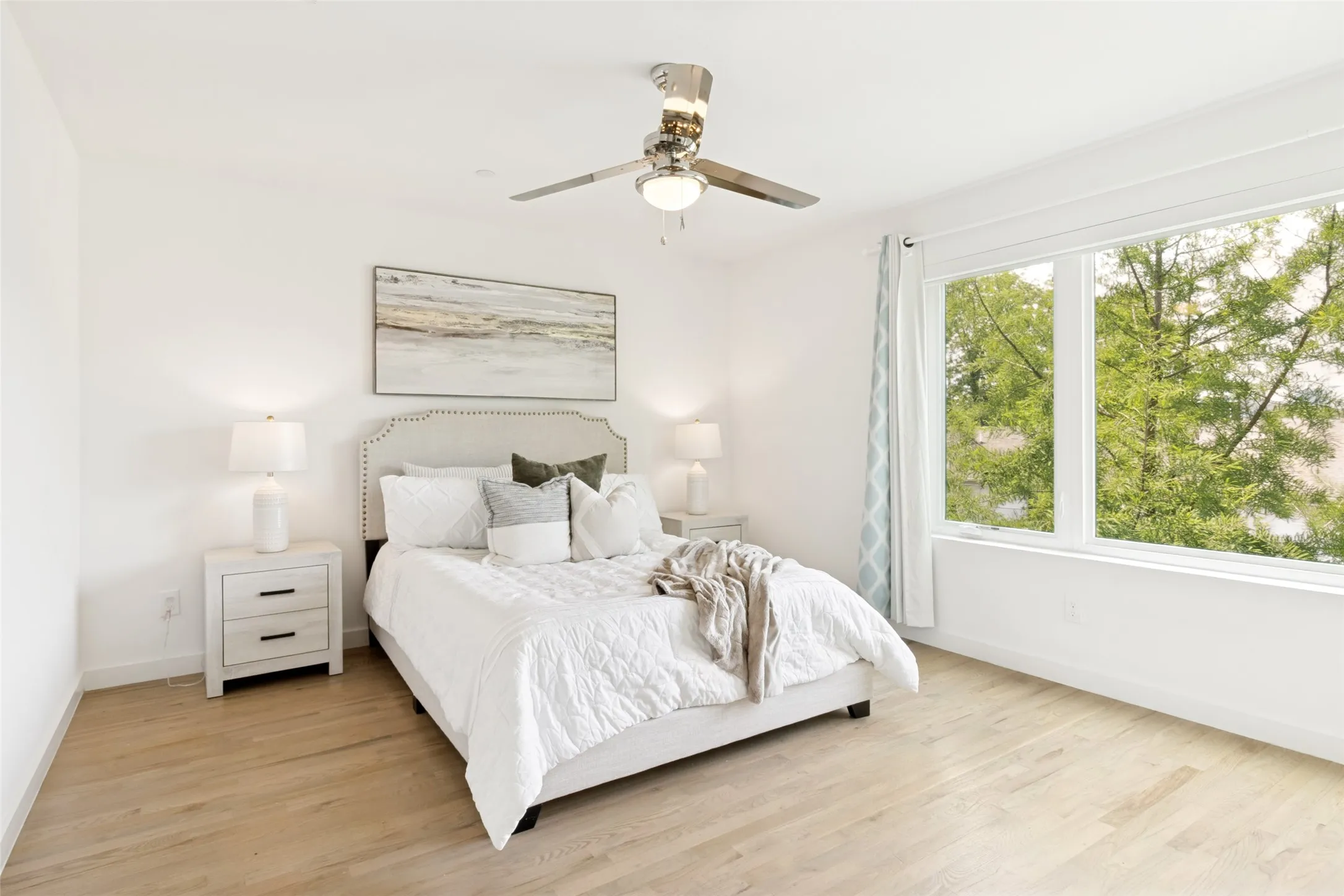 wood floors throughout. Beautiful picture window with tree top views.
