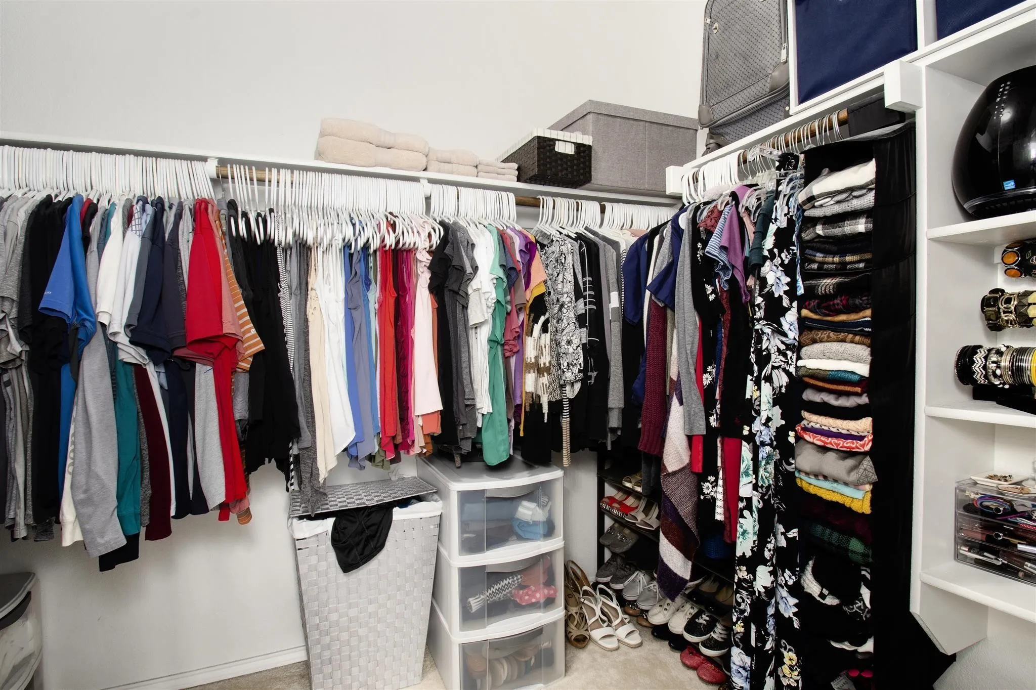 Built-in shelving and hanging rods providing ample storage