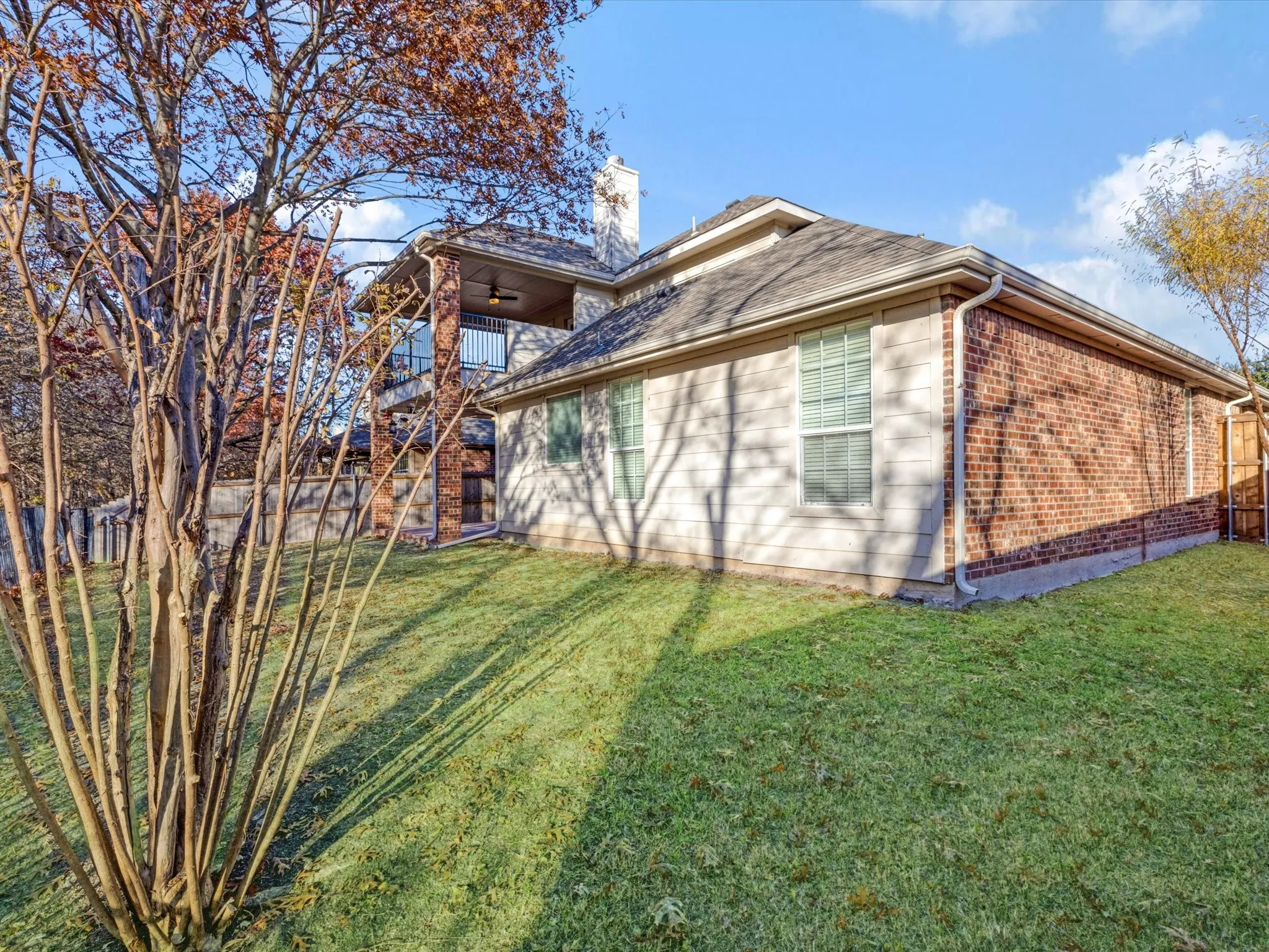 Expansive grassy yard with mature trees