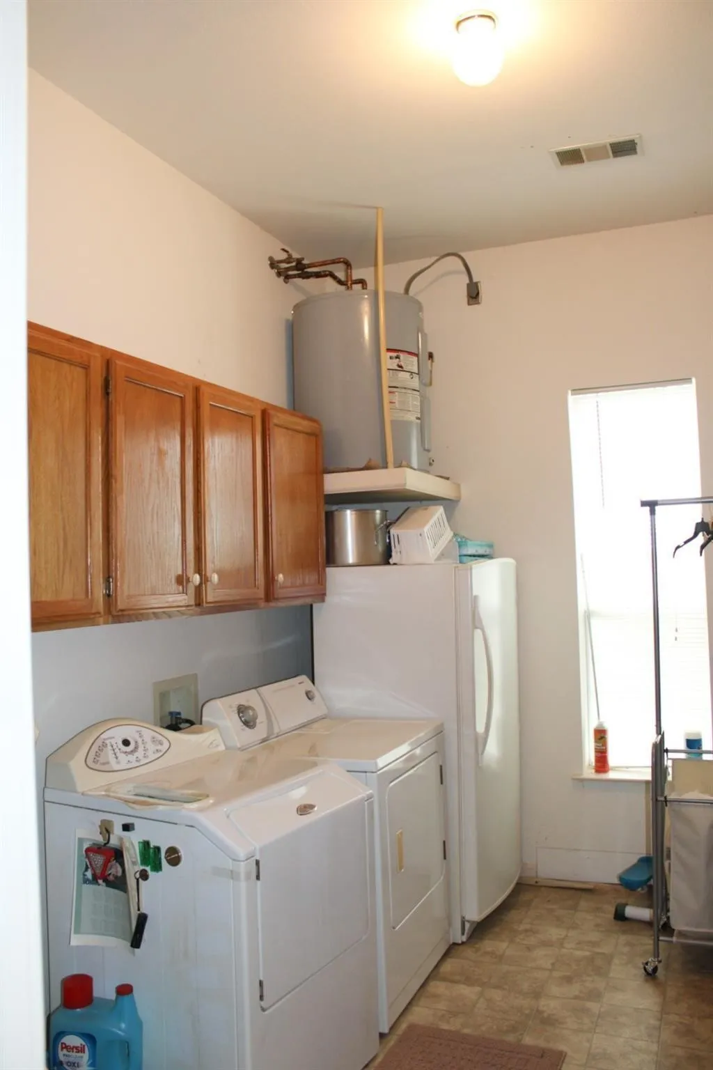 Main Laundry Area inside the house with cabinets. Second Laundry connections in 1 car attached garage.