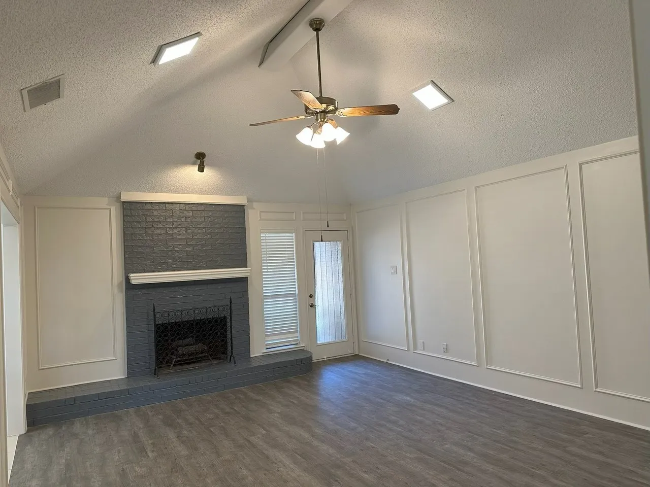 Features lofted ceilings and a fireplace