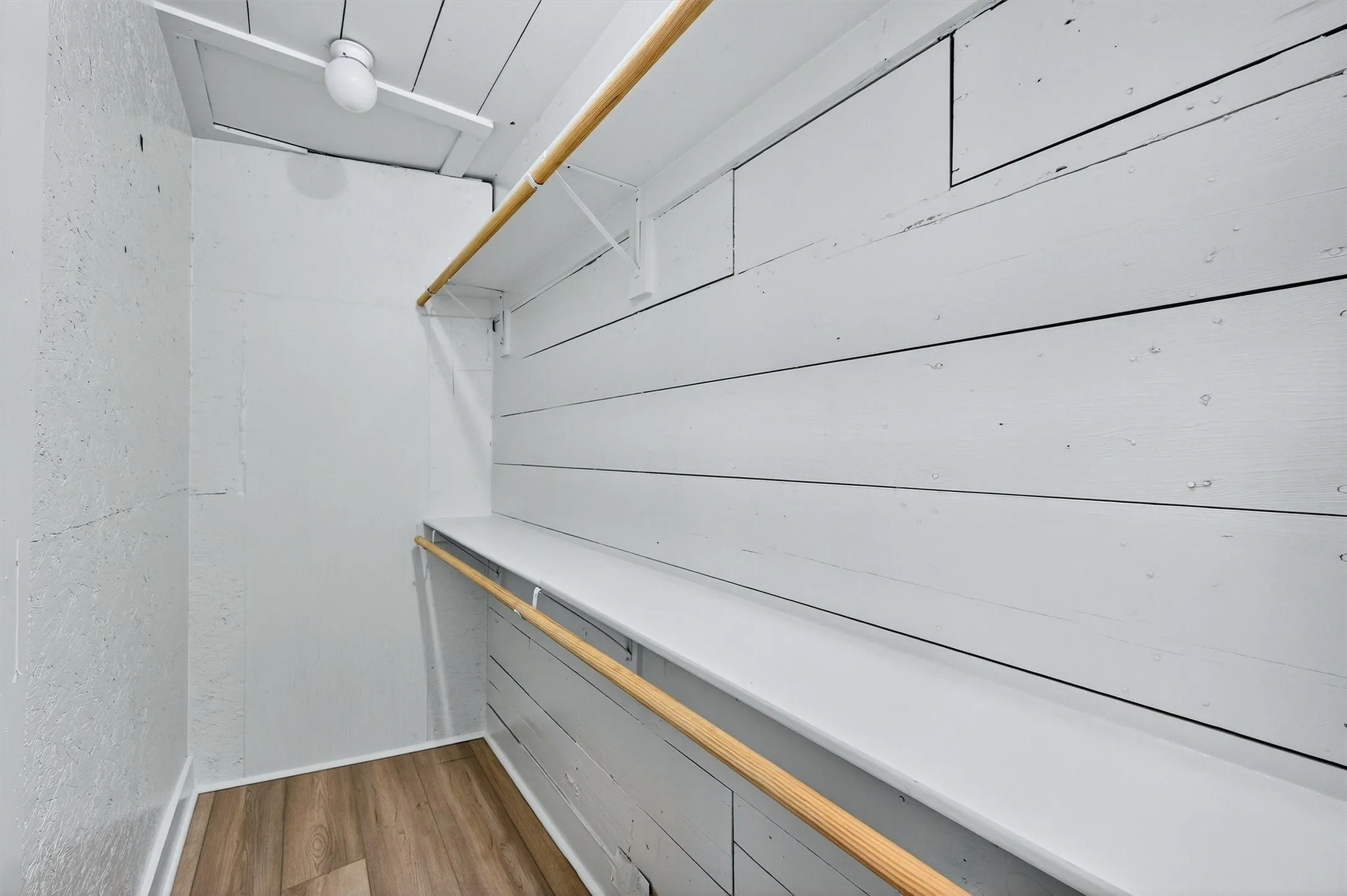 Spacious closet with wood finished floors