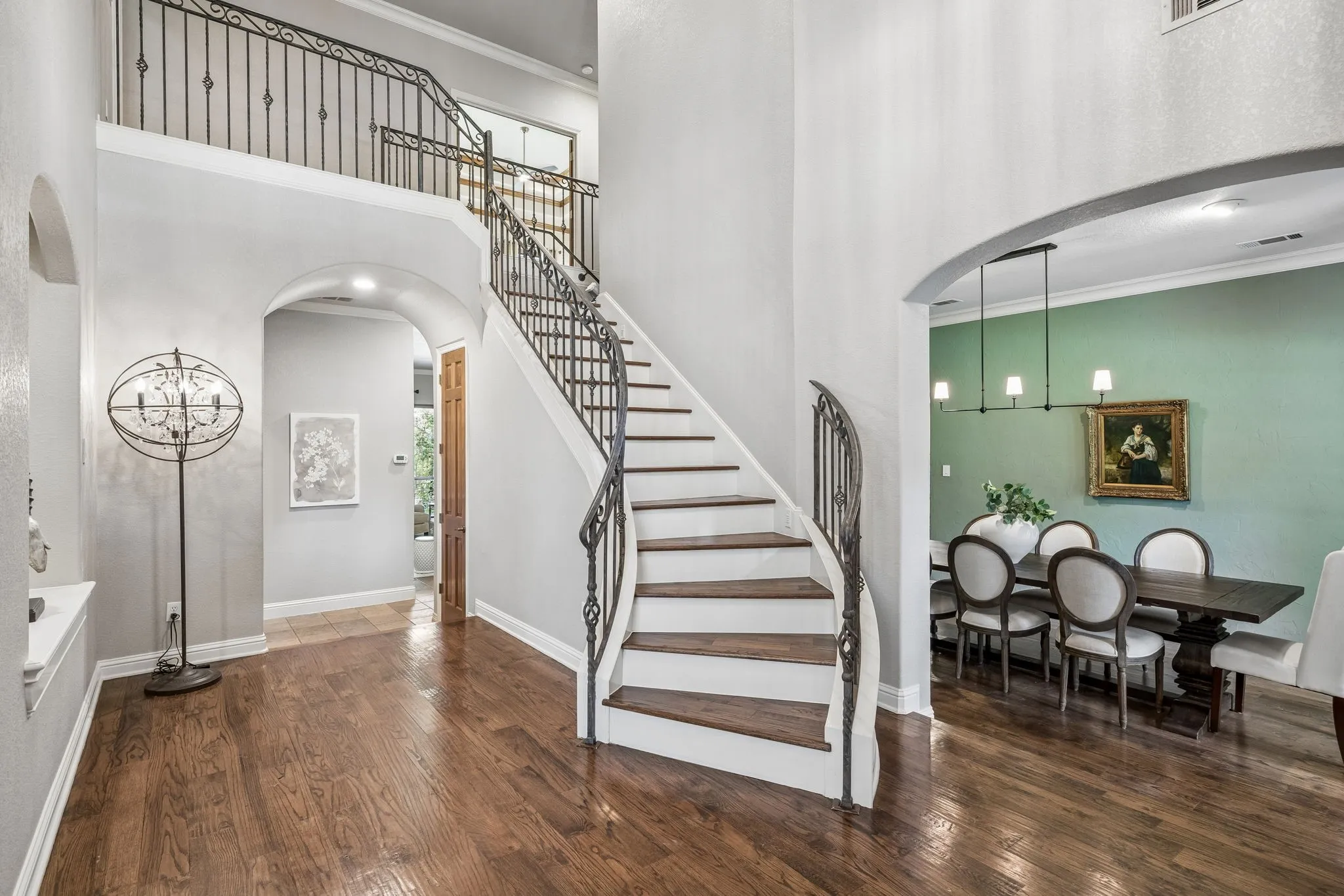 Foyer with soaring ceilings and grand staircase