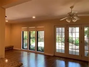 view of den with breakfast area enjoys private courtyard
