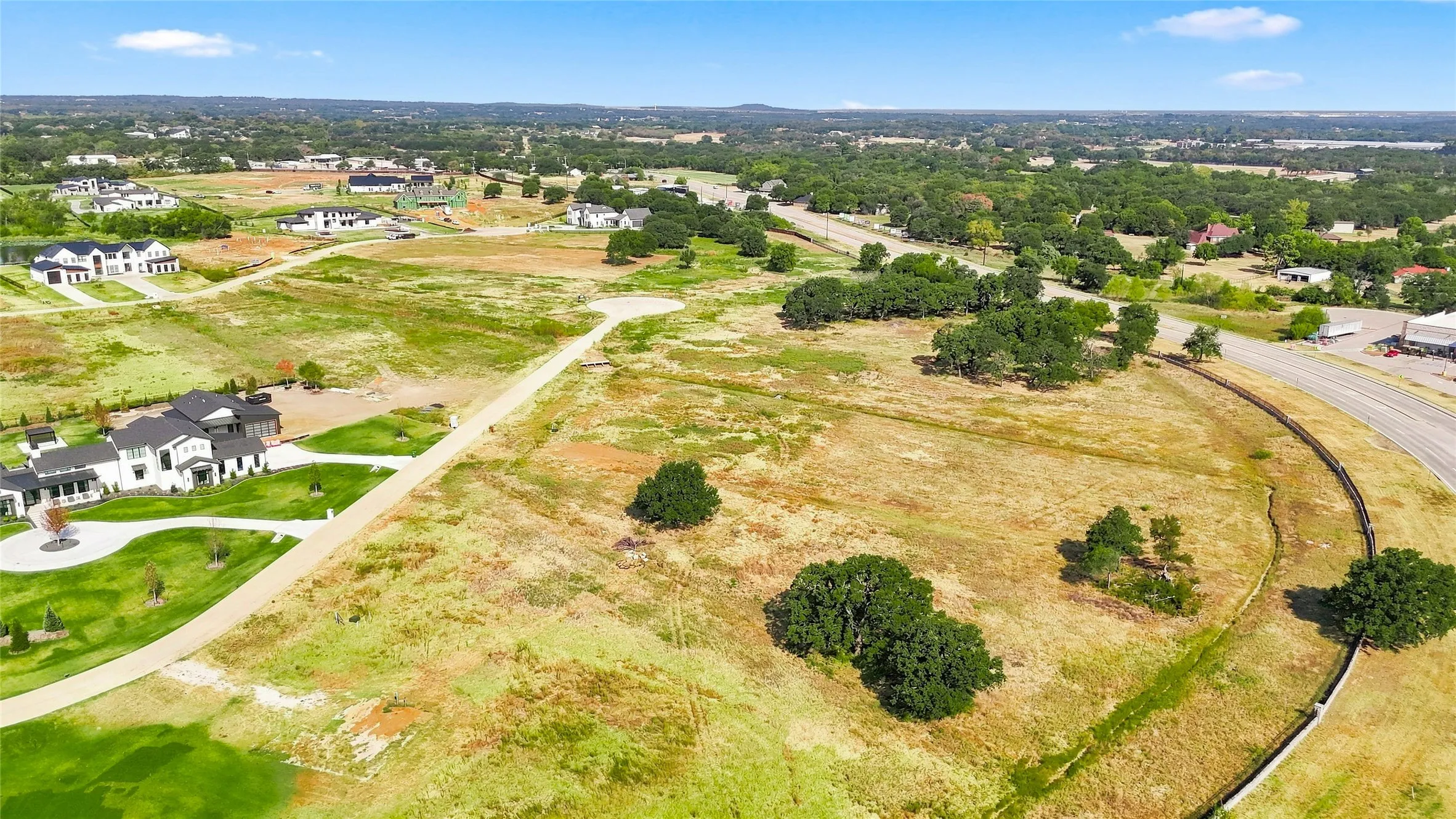 Expansive undeveloped land featuring scattered mature trees