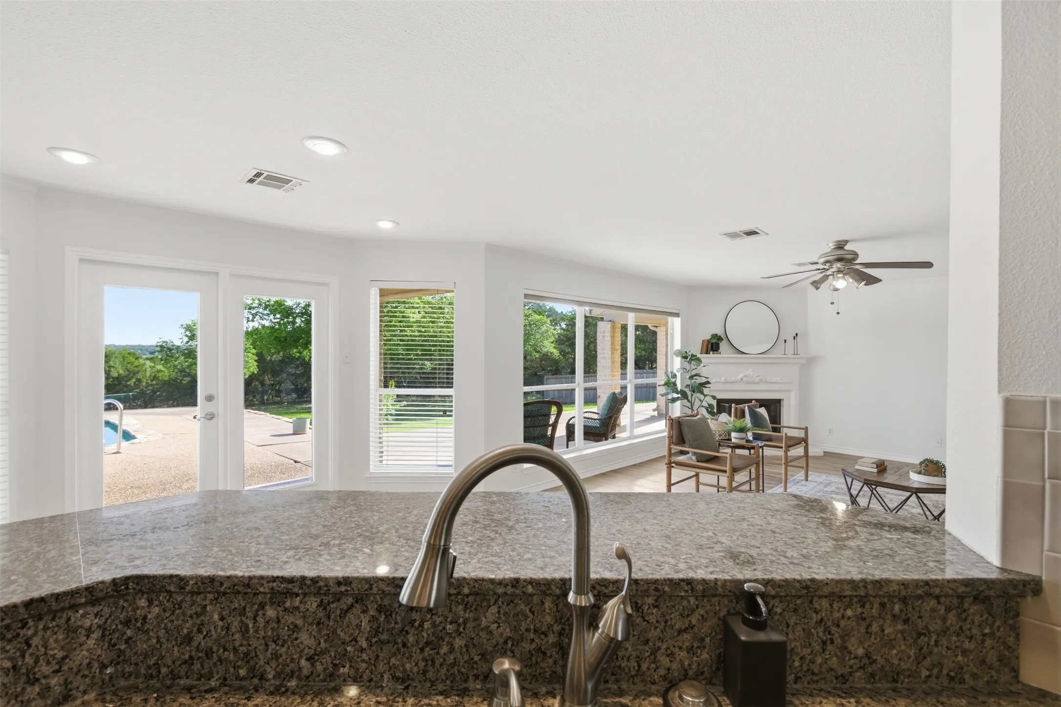 Granite-finish countertop with an undermount sink and gooseneck faucet