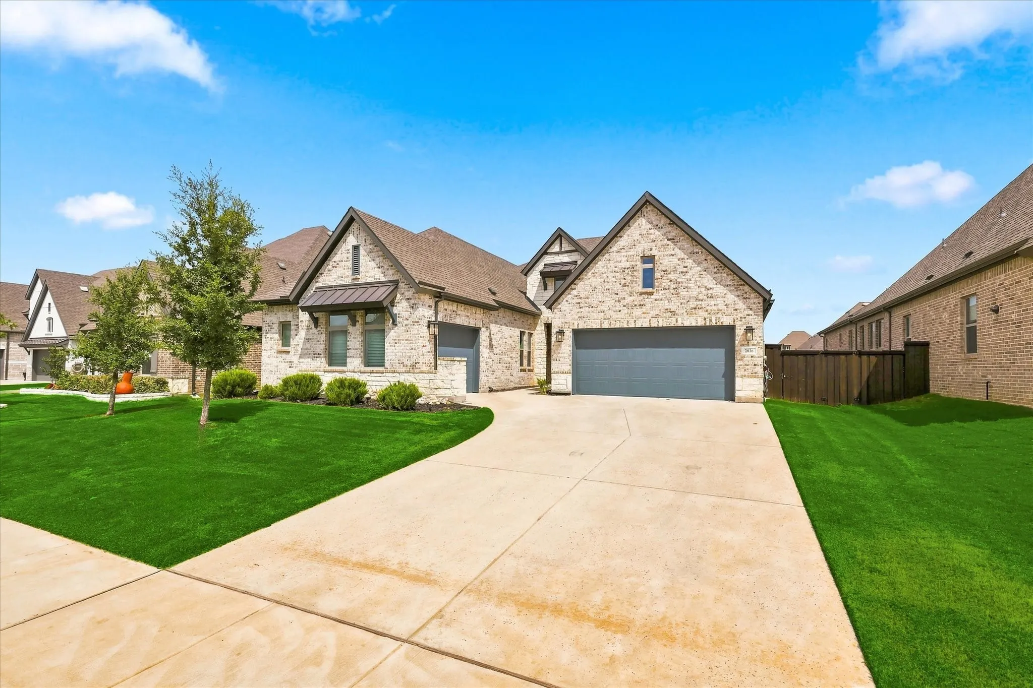 Brick and stone exterior with architectural shingles