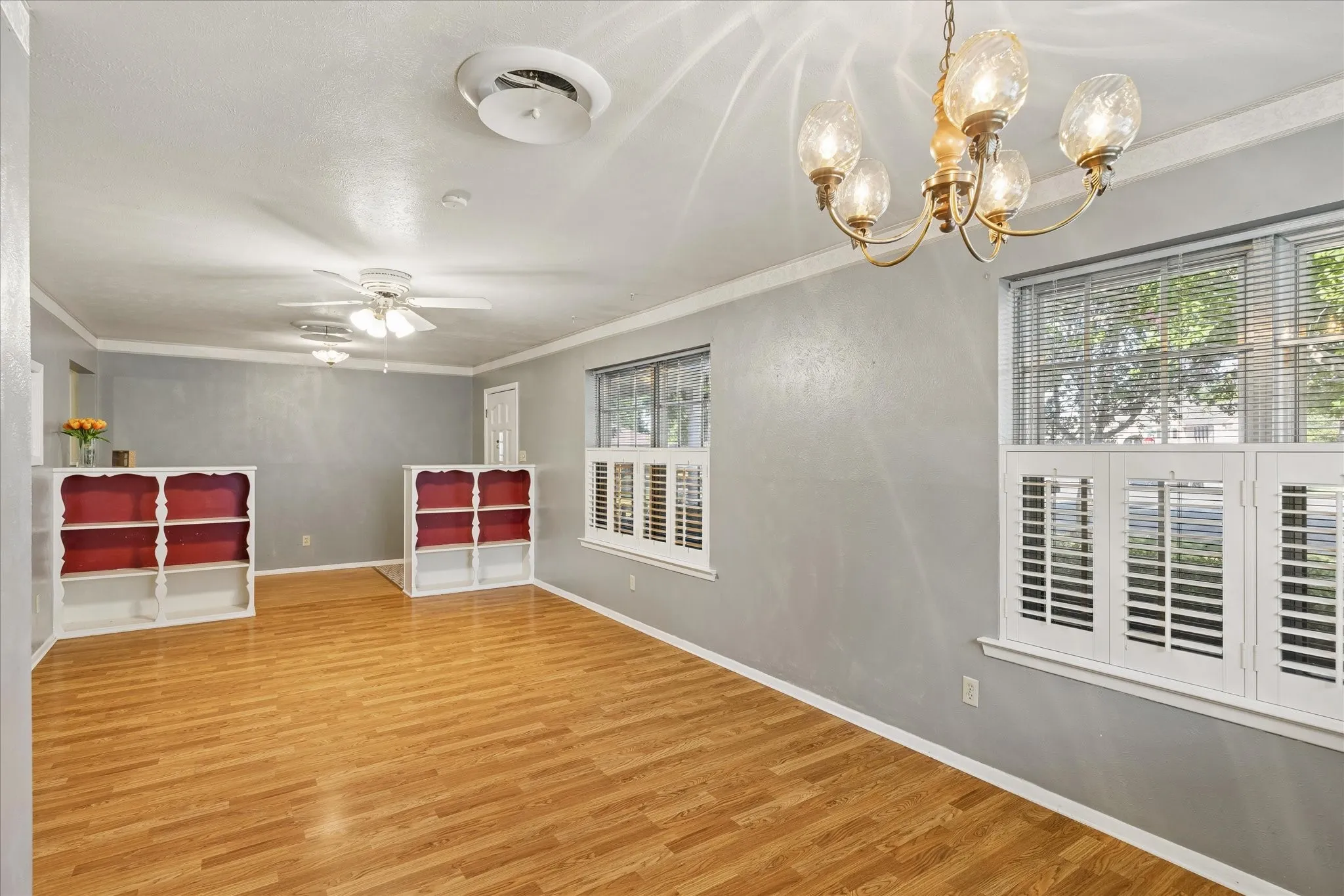 Open Living and Dining Area with Built-in Book Cases