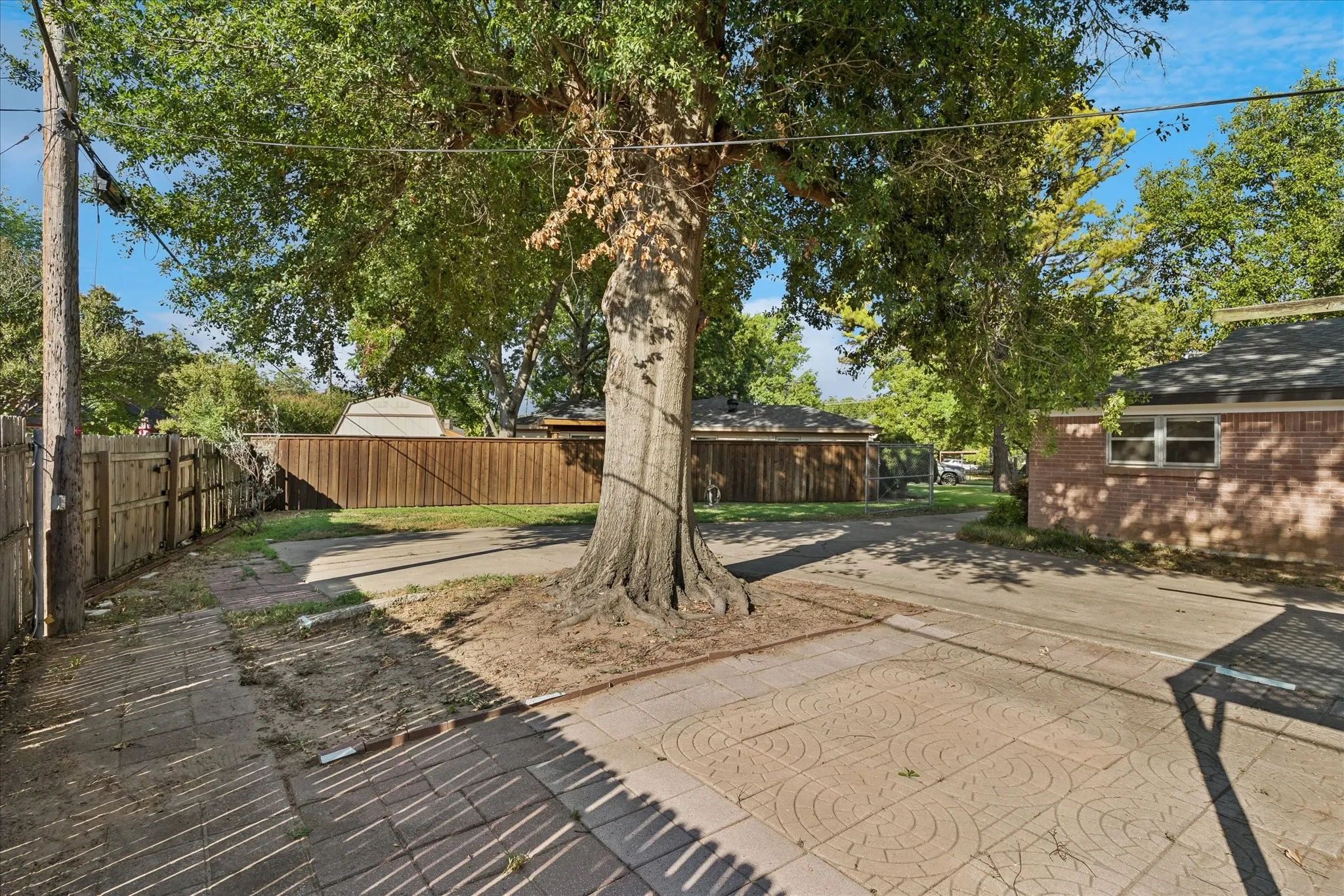 Gated entry to back yard and additional parking