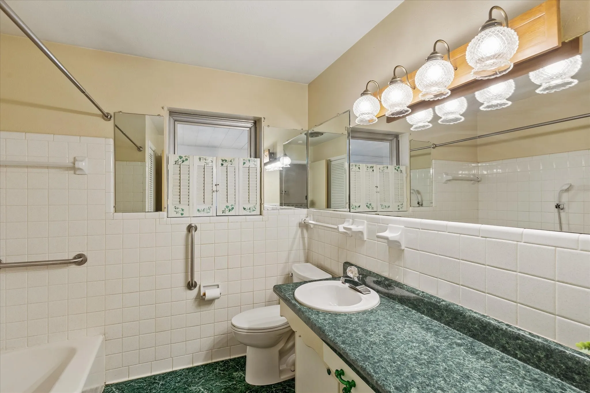 Secondary Bathroom has a tub and linen closet