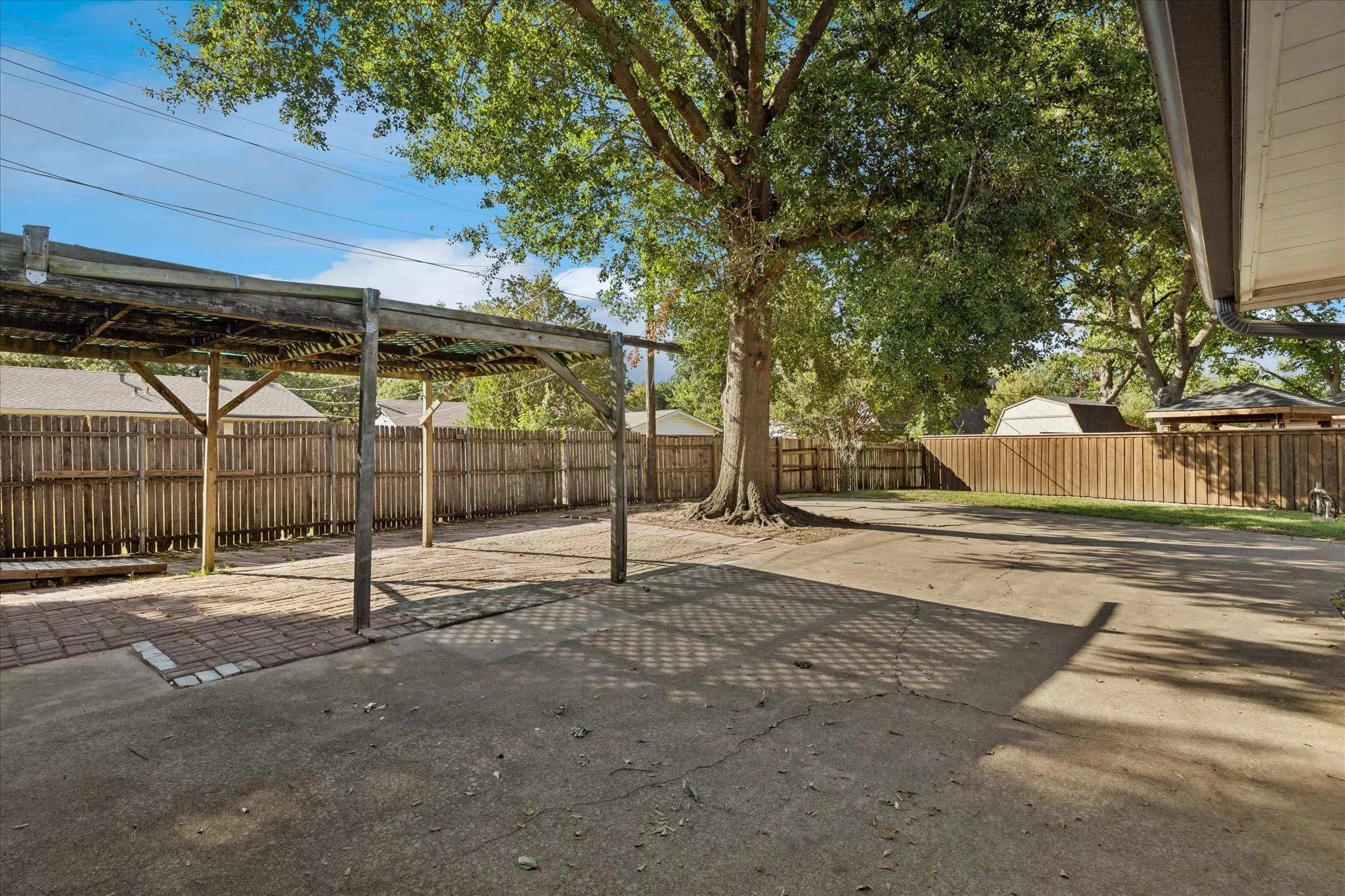 View showing Carport, drive and additional parking