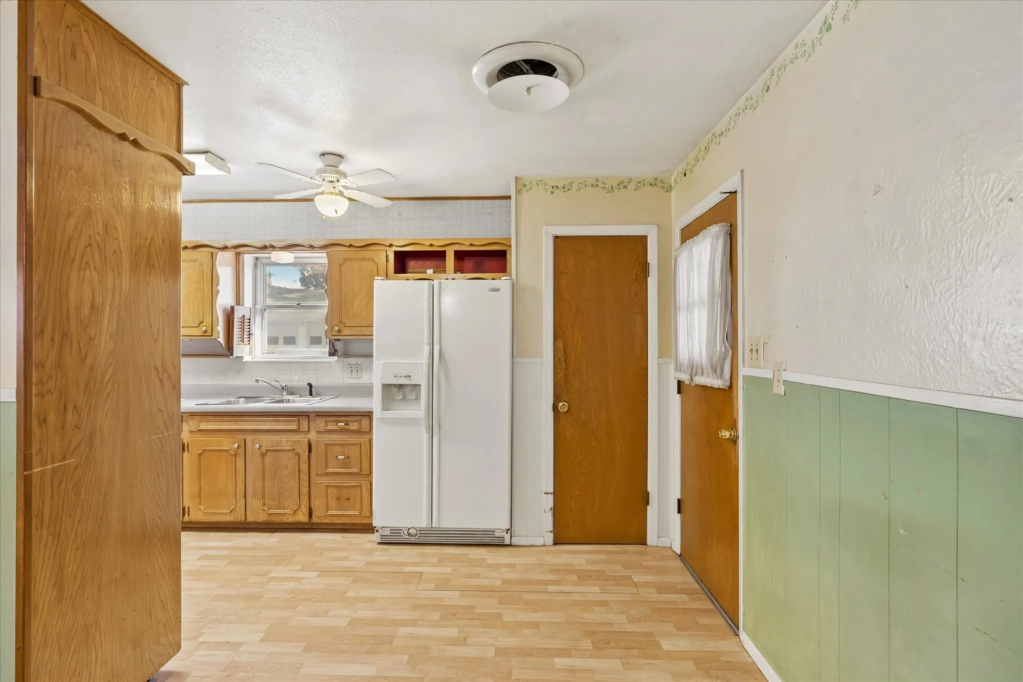 Pantry and Fridge in Kitchen
