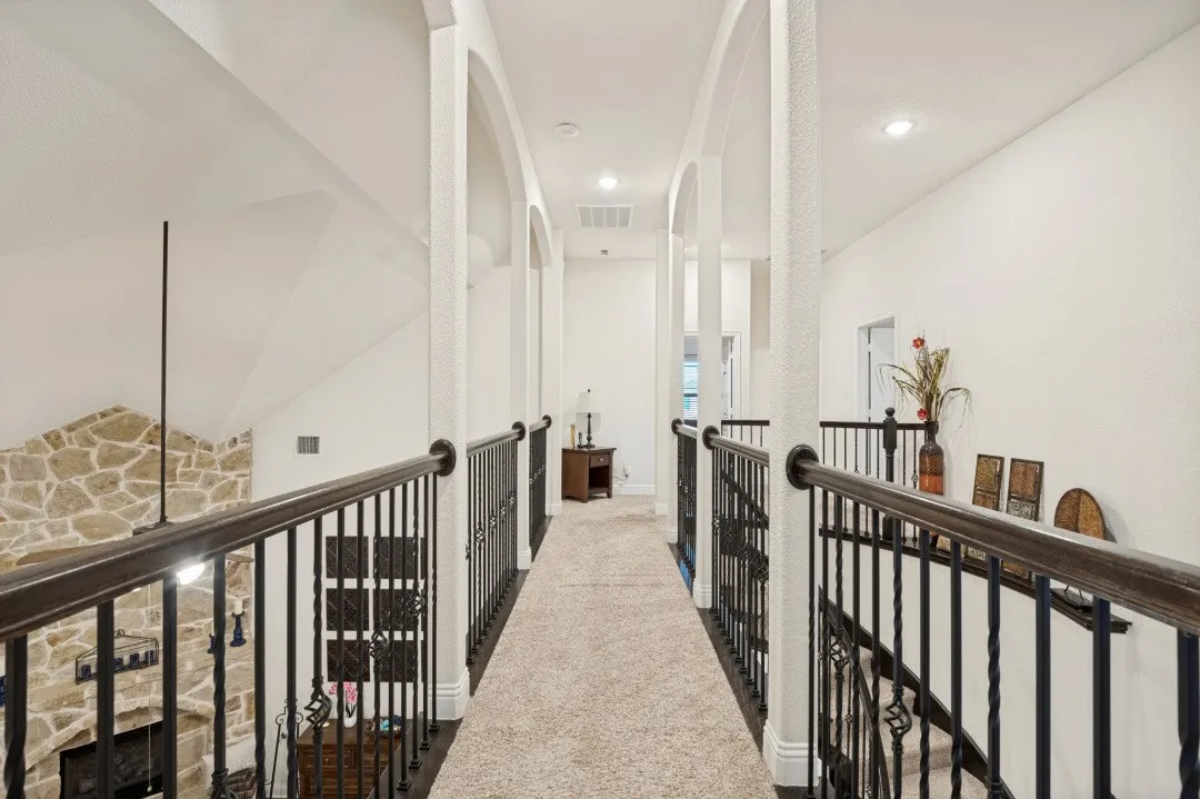 Arched hallway entryways with recessed lighting