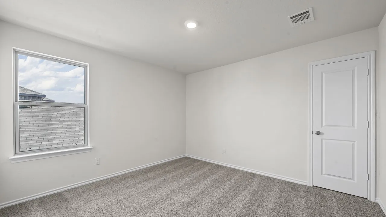 Recessed lighting, light gray carpeting, single window, white paneled door, and white painted walls