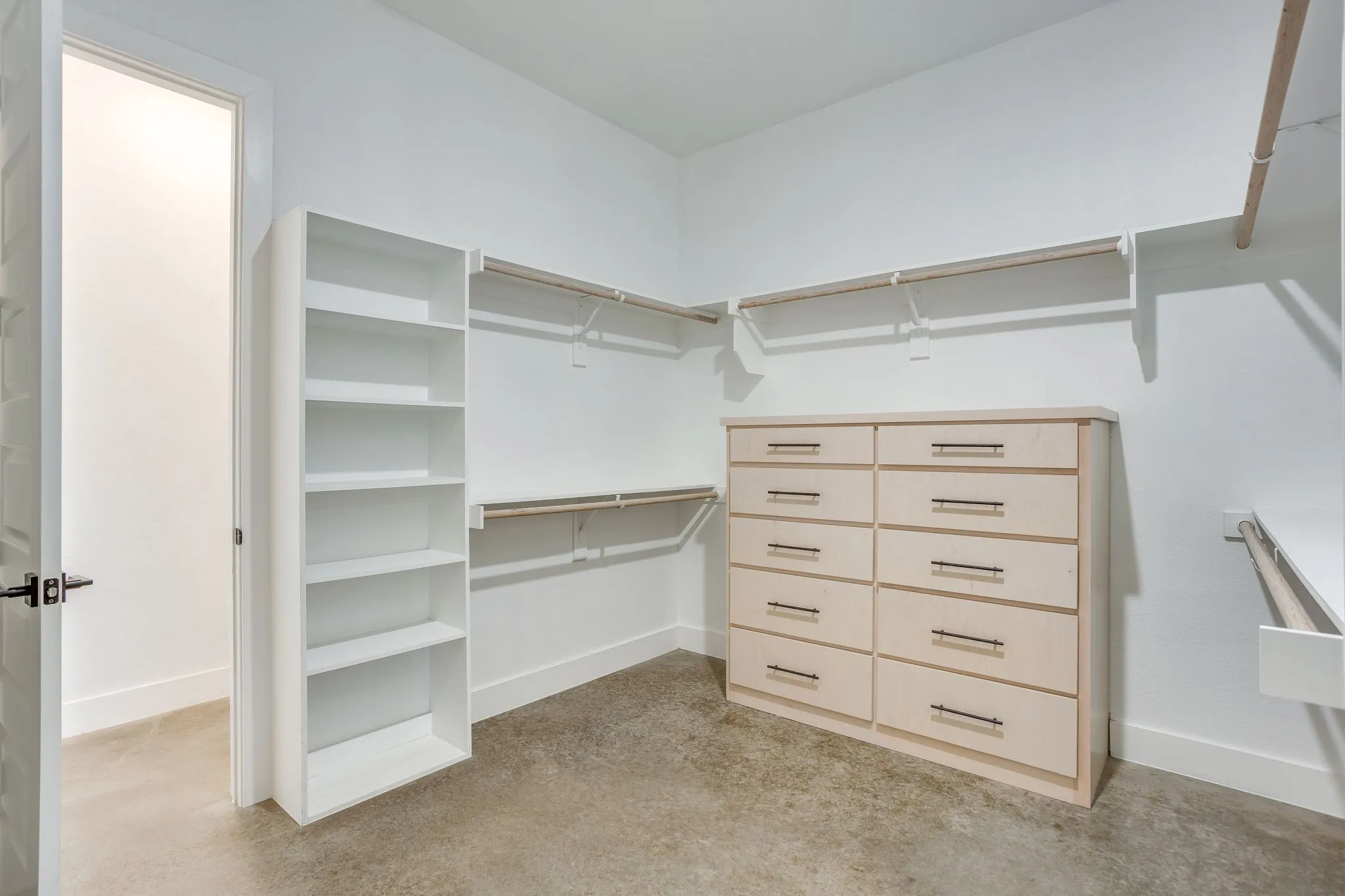 Oversized walk-in closet with built in dresser