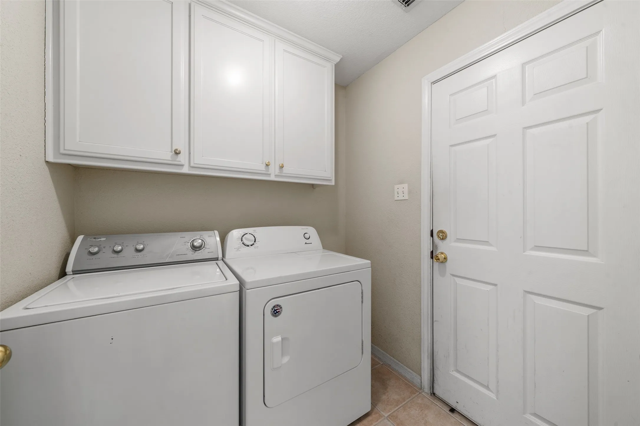 White cabinetry with gold-tone hardware
