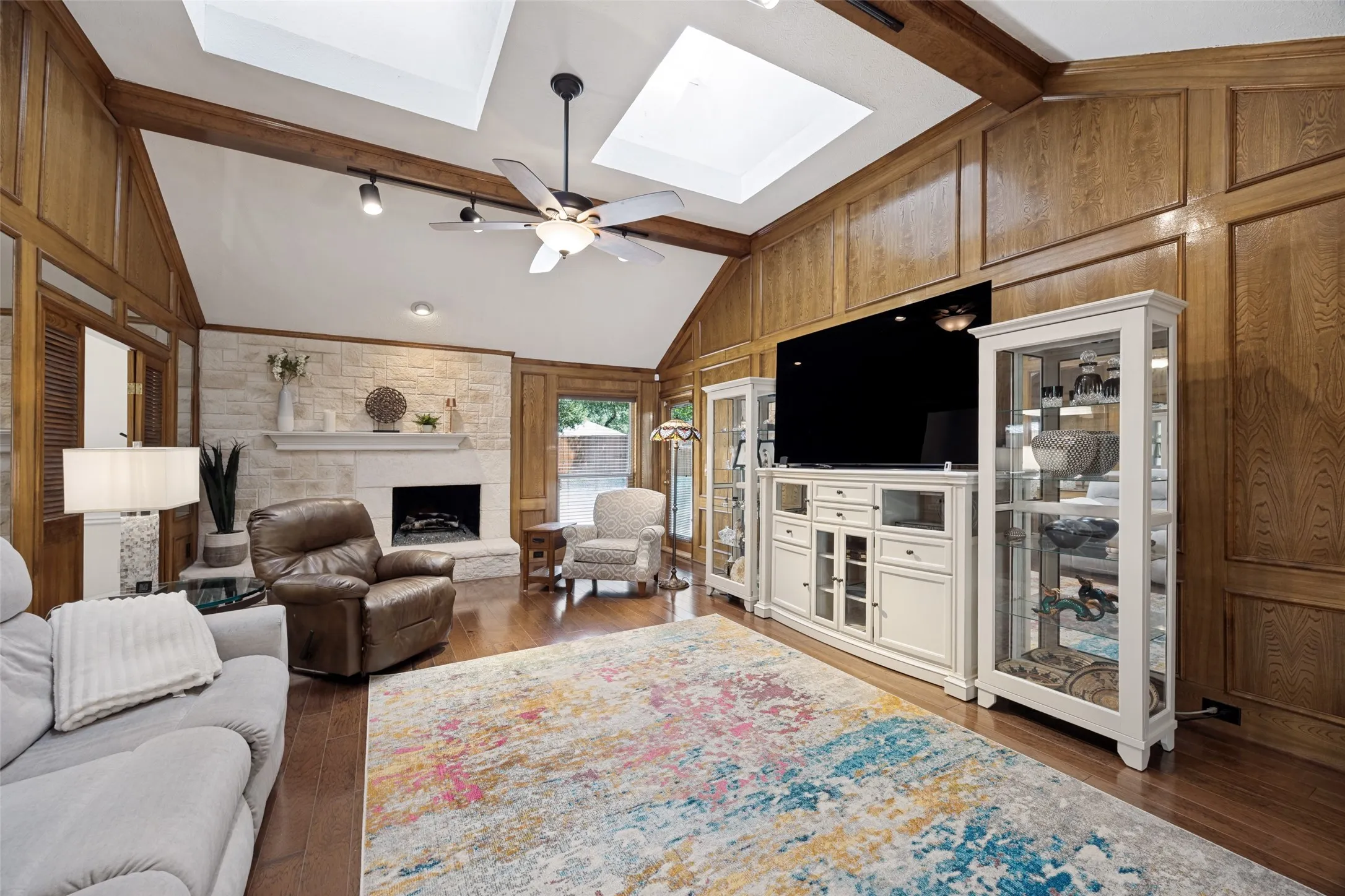 The living room viewed from the front door. Tall ceilings and multiple skylights for lots of natural light.