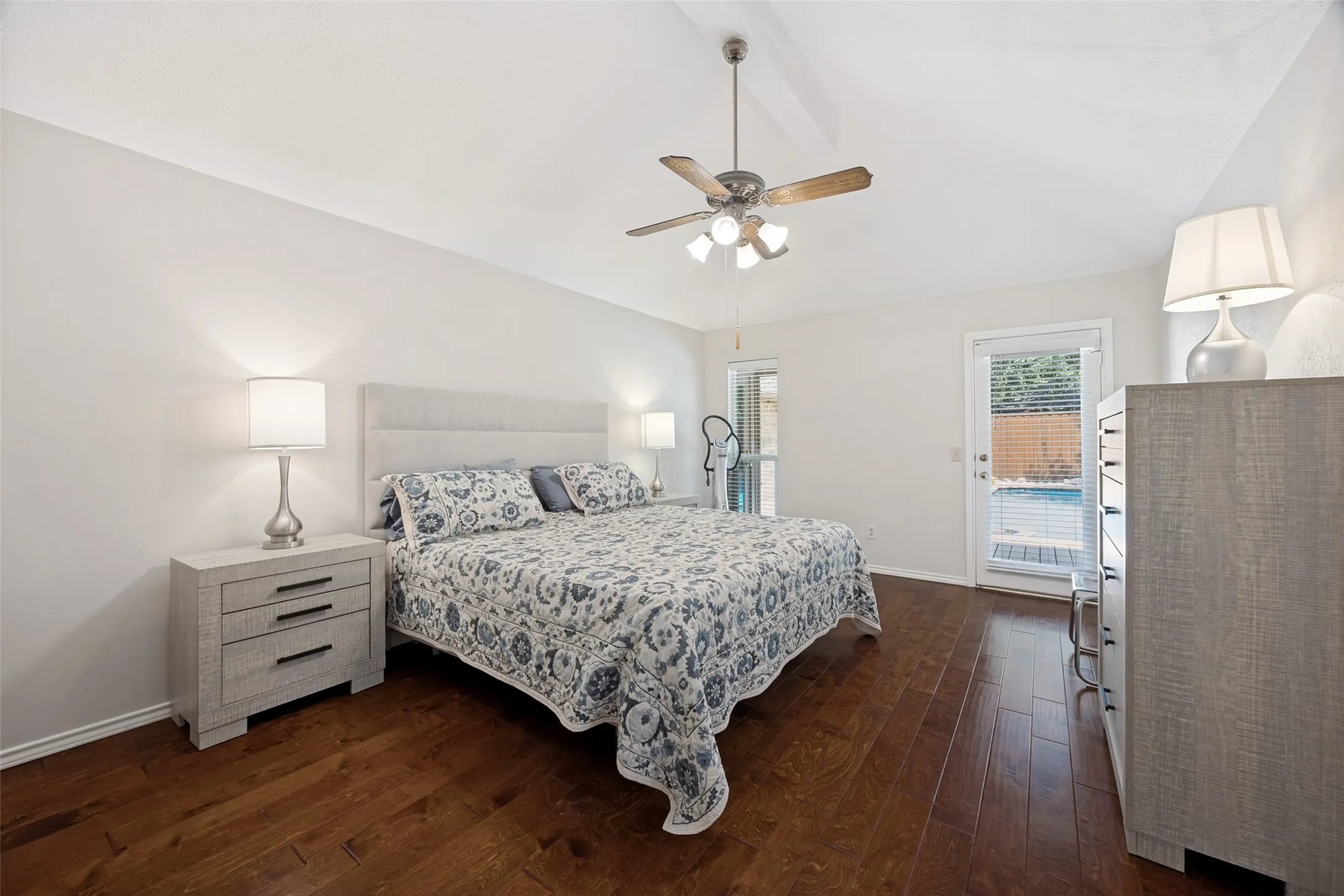 Very spacious primary bedroom with access to the backyard pool area.