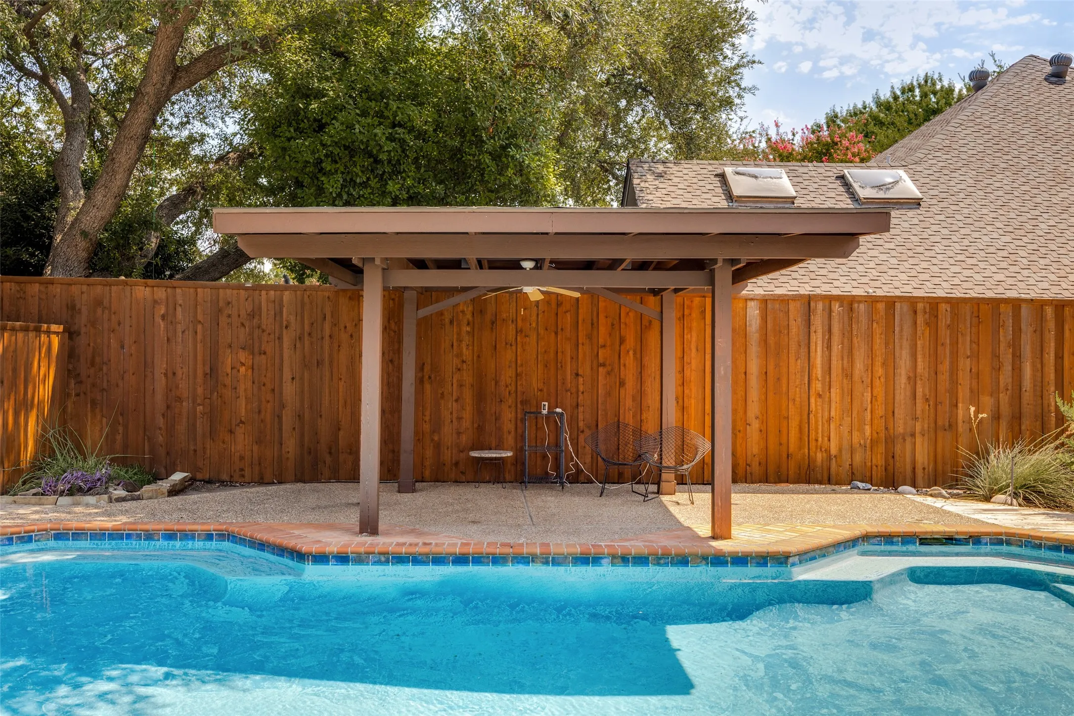 Cool off under the pool side pergola