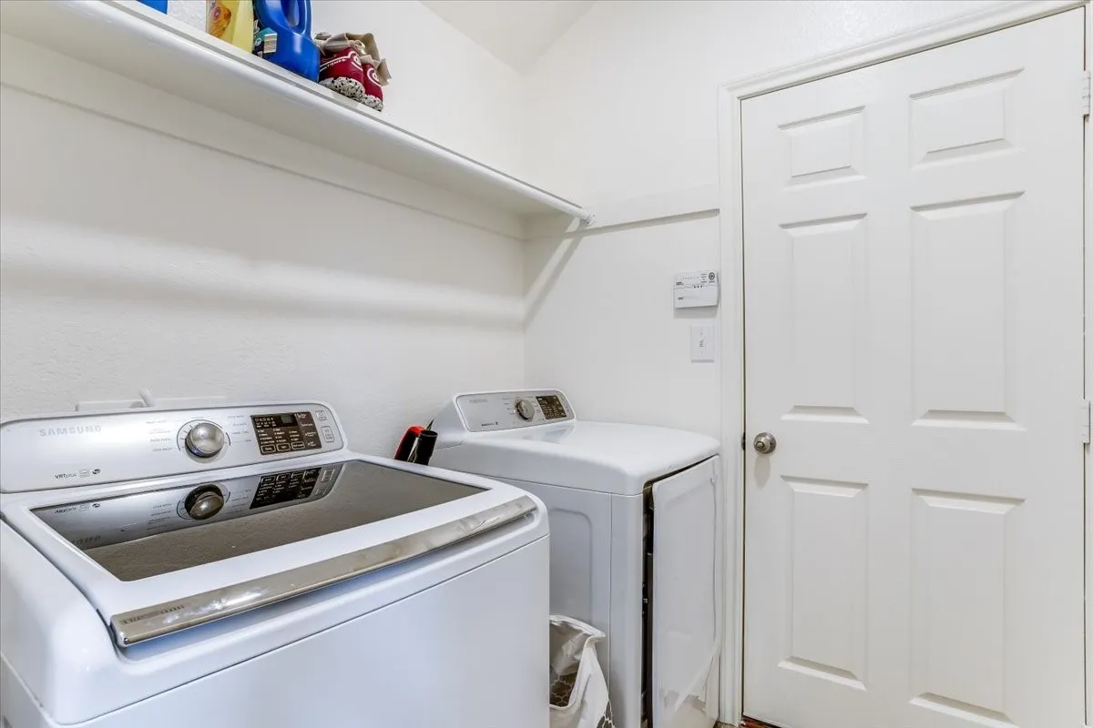 White interior door, wall-mounted shelving