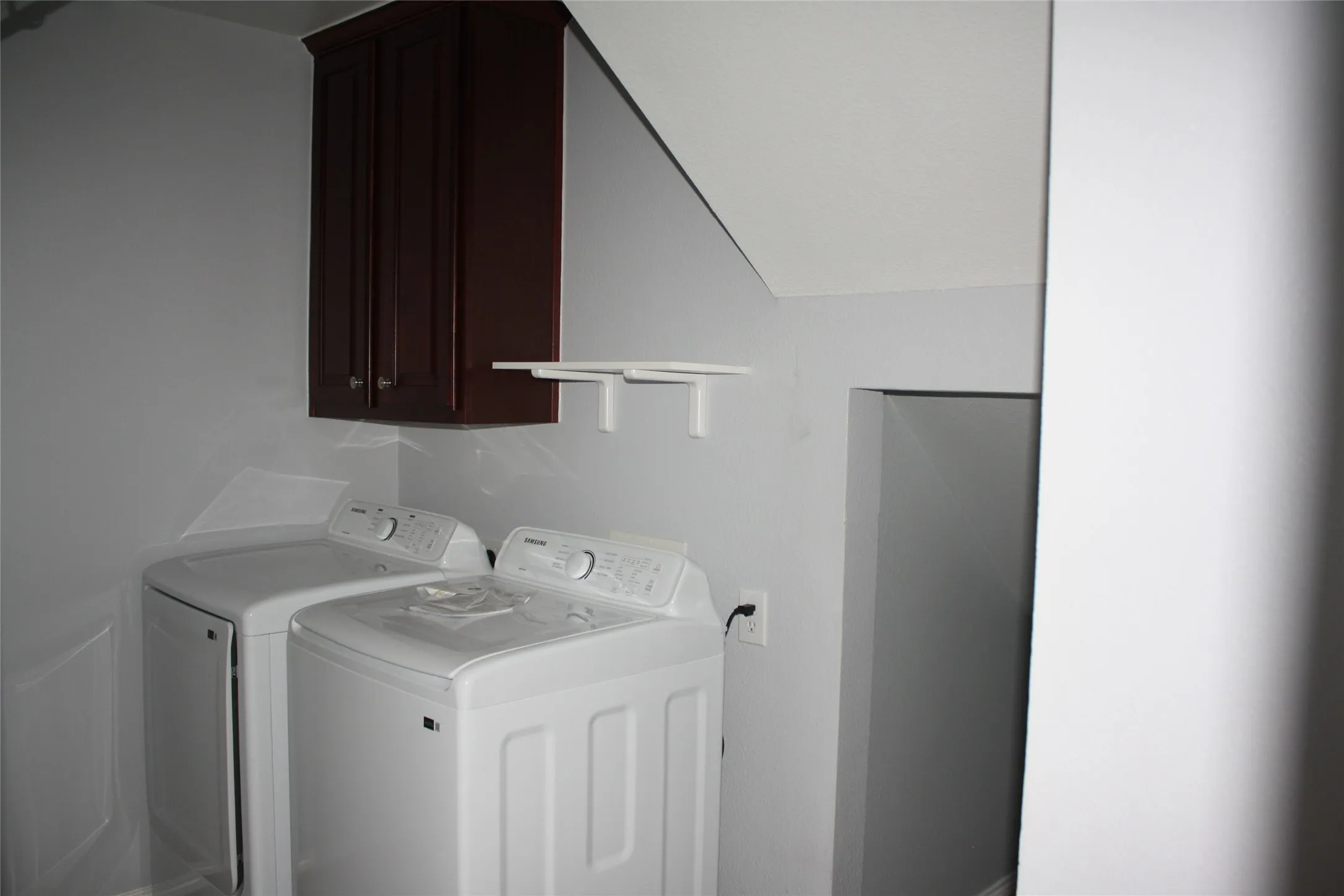 Built-in dark wood cabinetry with storage shelves