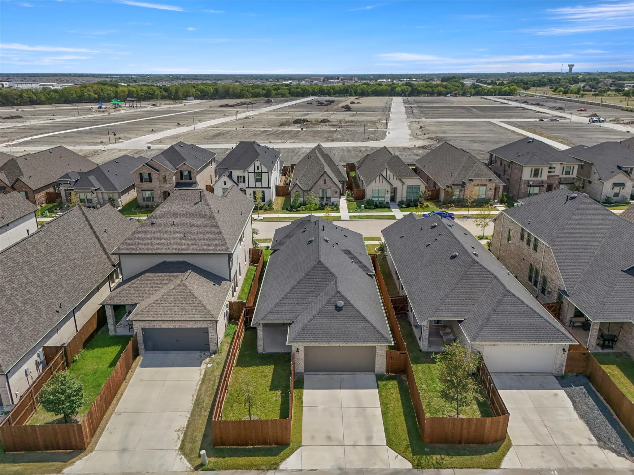 Contemporary residential architecture with dark shingle roofing