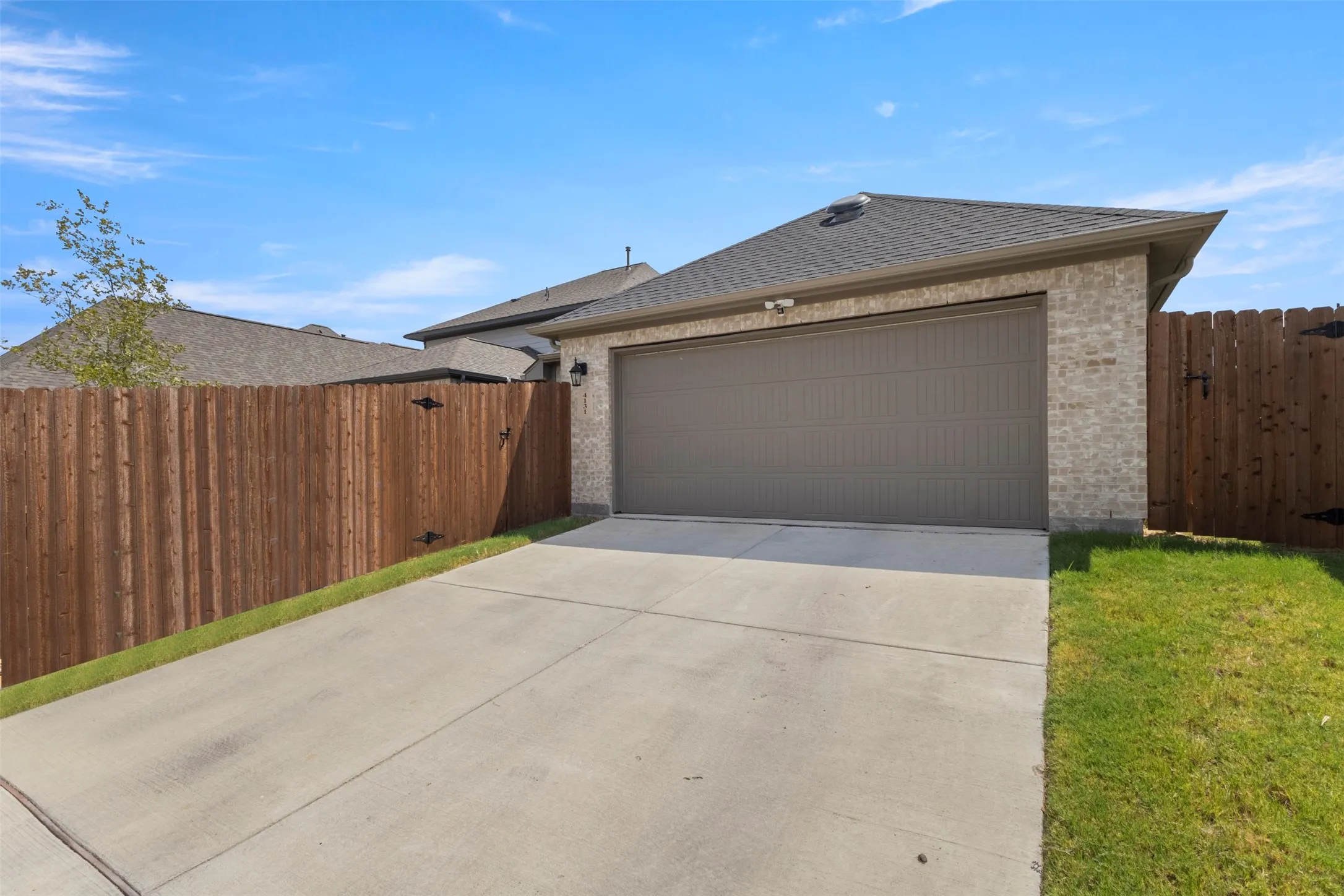 Manicured lawn with wood privacy fencing