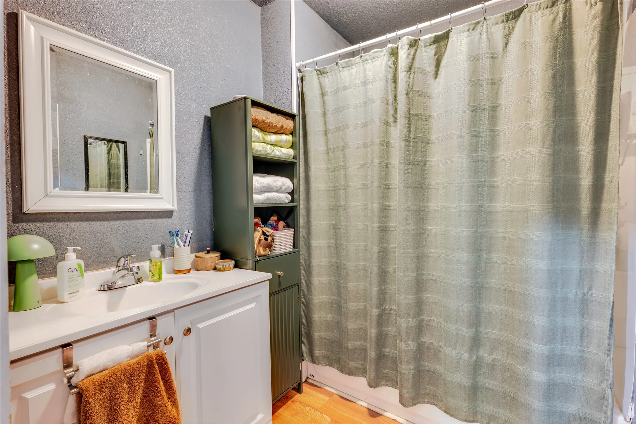Vanity with an integrated sink and chrome faucet