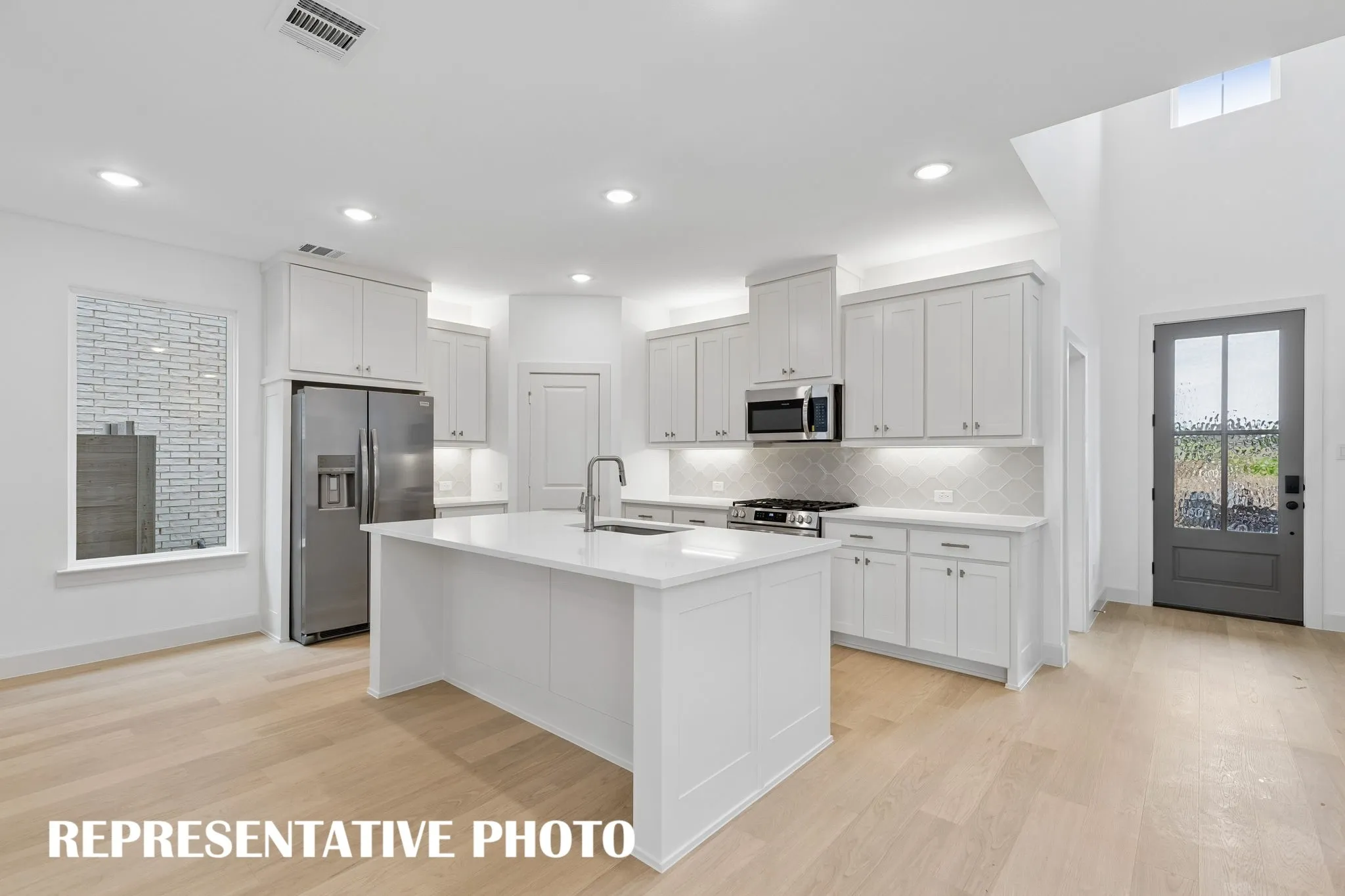 All the chef's in the family will enjoy ample prep and storage space in this dream kitchen!  REPERESENTATIVE PHOTO