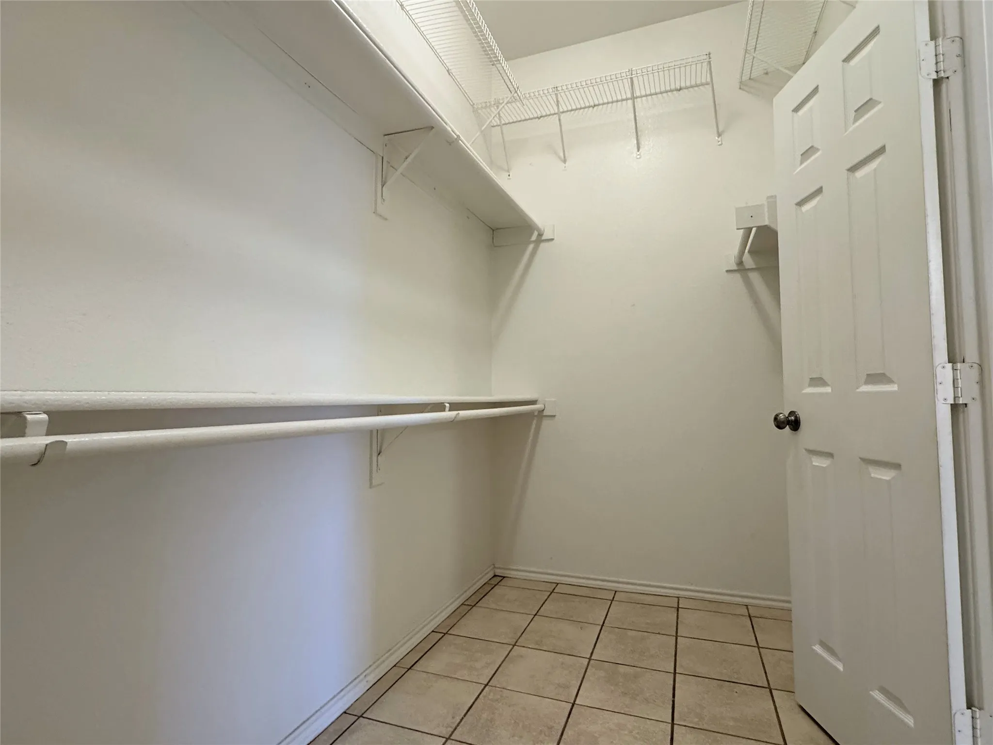 Primary closet has lots of storage space