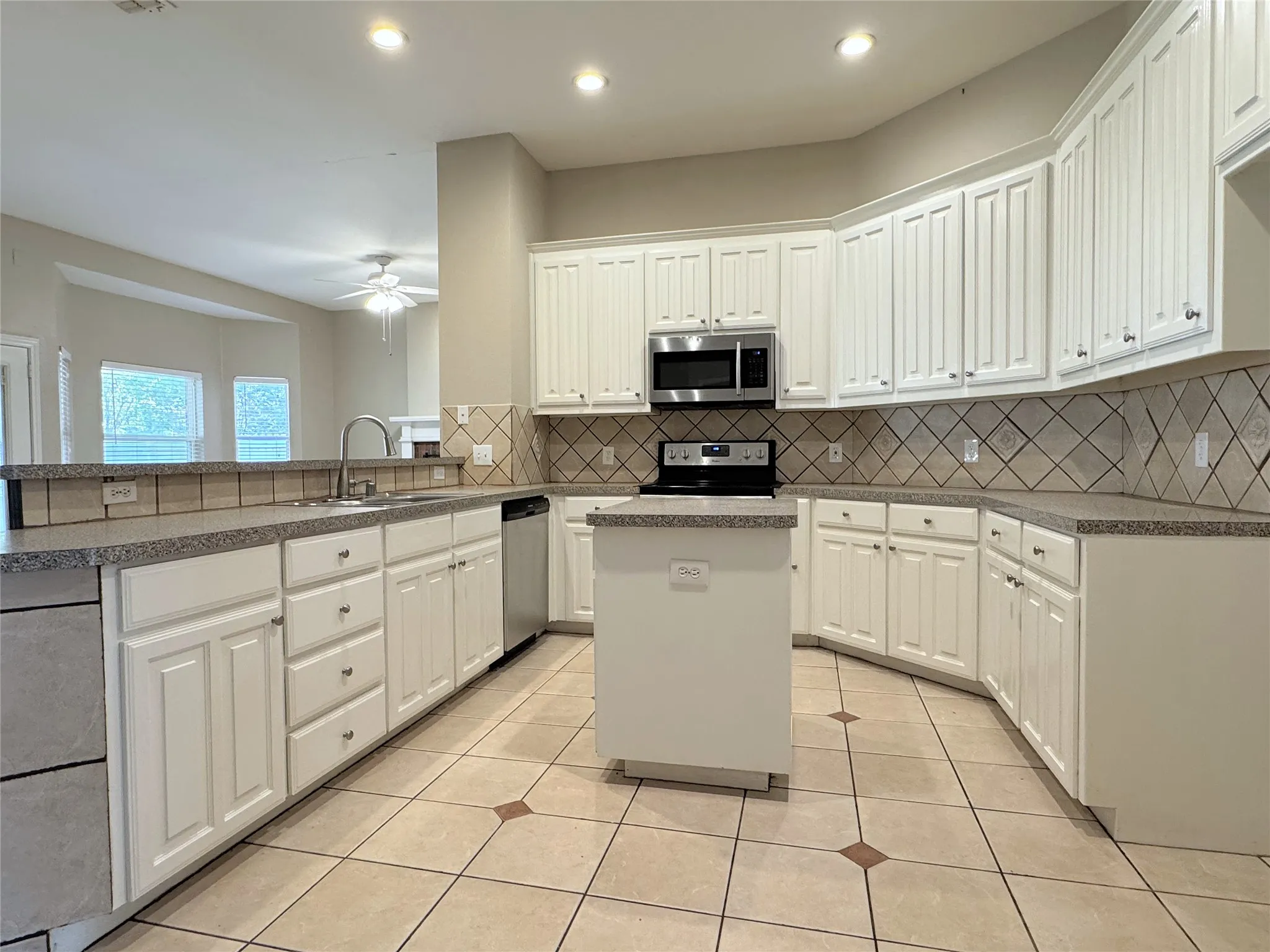 Open kitchen with lots of cabinets